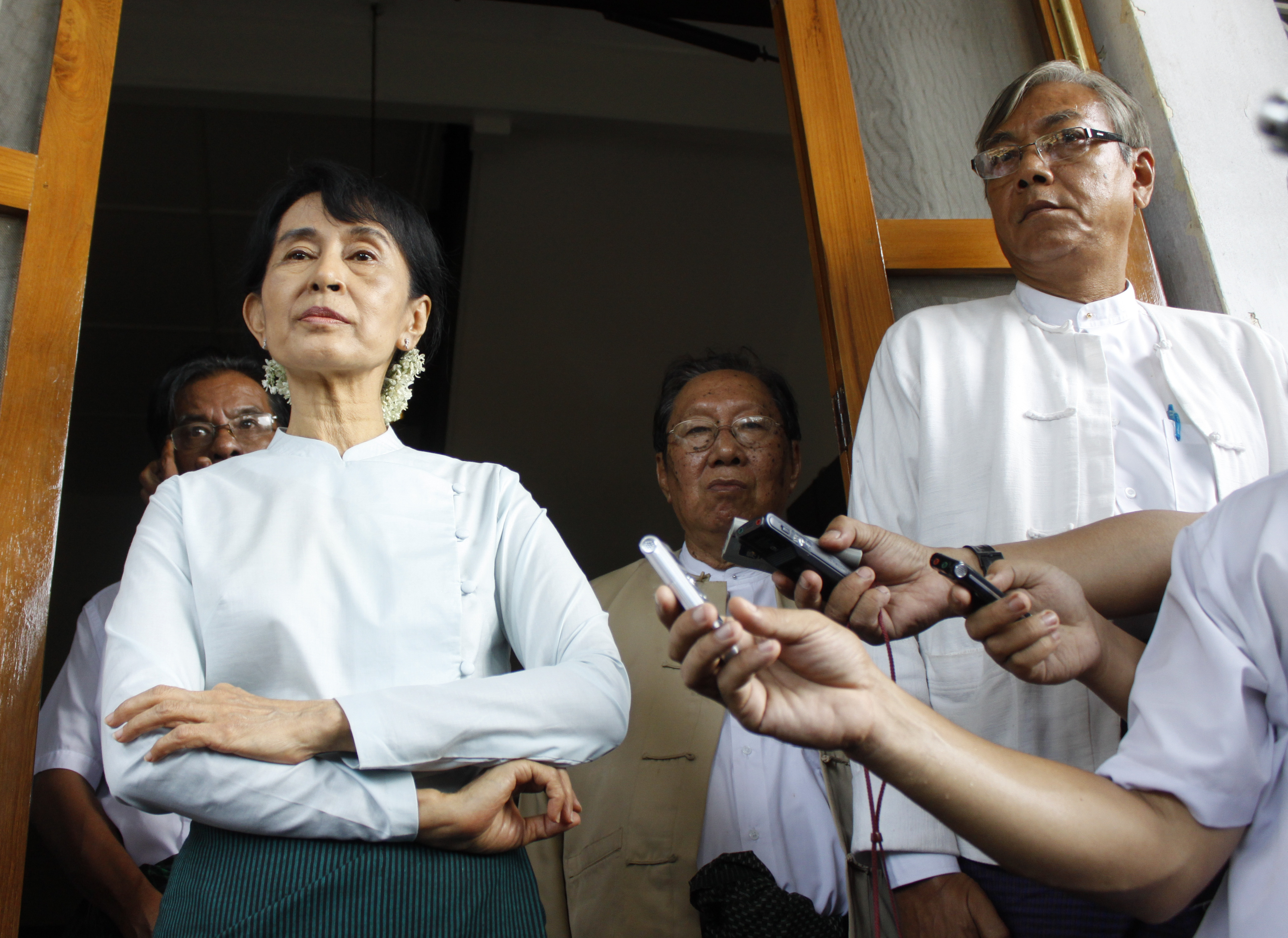 Presidential nominee Htin Kyaw (R), is seen standing next to Aung San Suu Kyi in this file photo from a press meeting at her residence in Rangoon, Burma, June 2, 2011. (Lynn Bo Bo—EPA)
