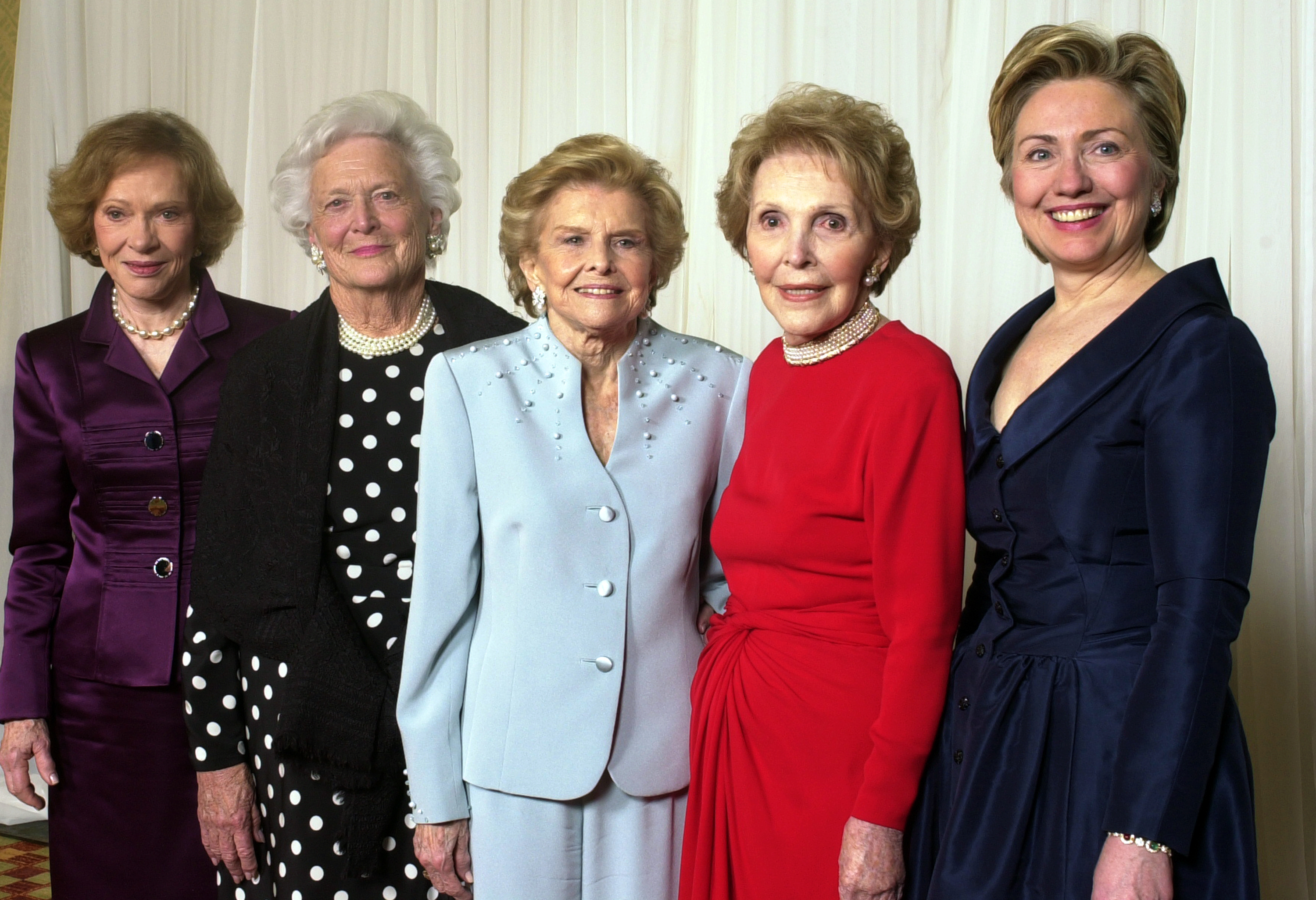 Former first ladies get together for a group photo at a gala 20th anniversary fundraising event saluting Betty Ford and the Betty Ford Center in Indian Wells, Calif. on Jan. 17, 2003.  From left are Rosalynn Carter, Barbara Bush, Betty Ford, Nancy Reagan and Sen. Hillary Rodham Clinton. (Reed Saxon—AP)