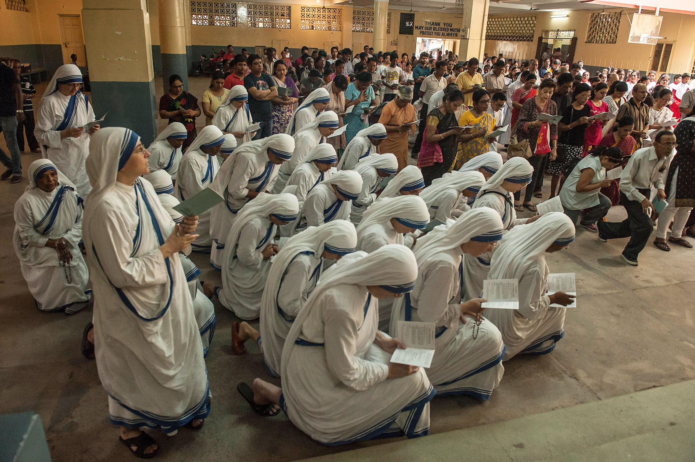 Indian Christians pray at a church on Good Friday in Kolkata, India, March 25, 2016.
