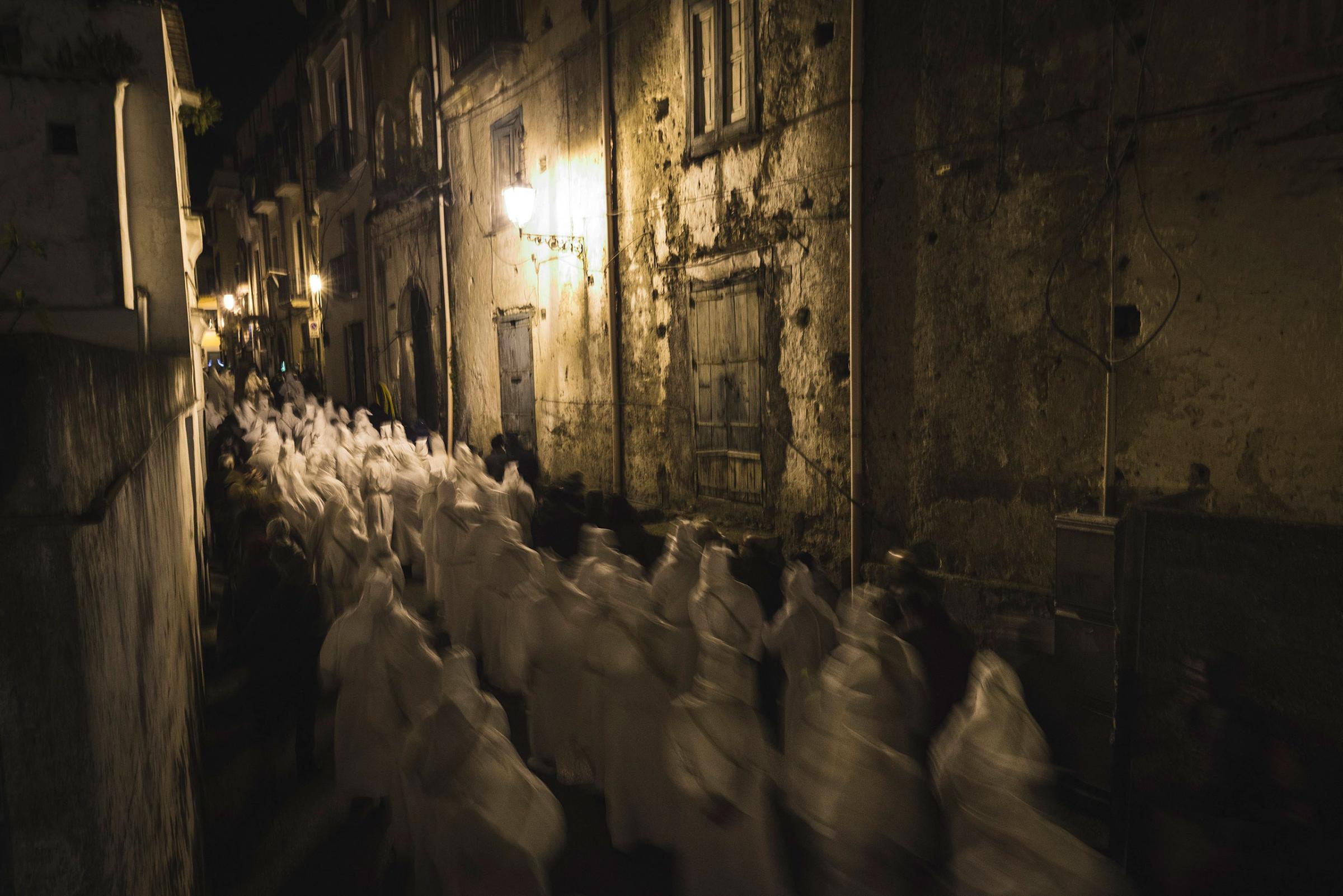 Participants attend the Penitential Procession of the "Battenti" with dozens of hooded penitents and centuries-old songs in Minori, Italy, March 24, 2016.