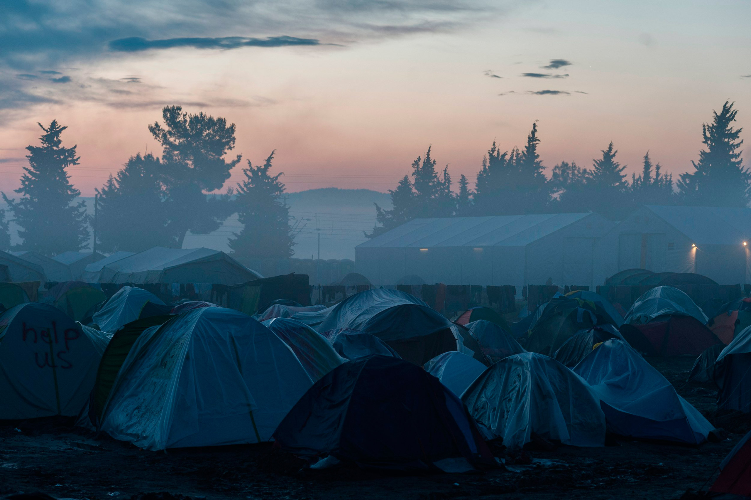 Fog engulfs a makeshift camp for migrants and refugees at the Greek-Macedonian border, near the Greek village of Idomeni, March 11, 2016. Markus Heine—NurPhoto/Corbis (Markus Heine&mdash;© Markus Heine/NurPhoto/Corbis)