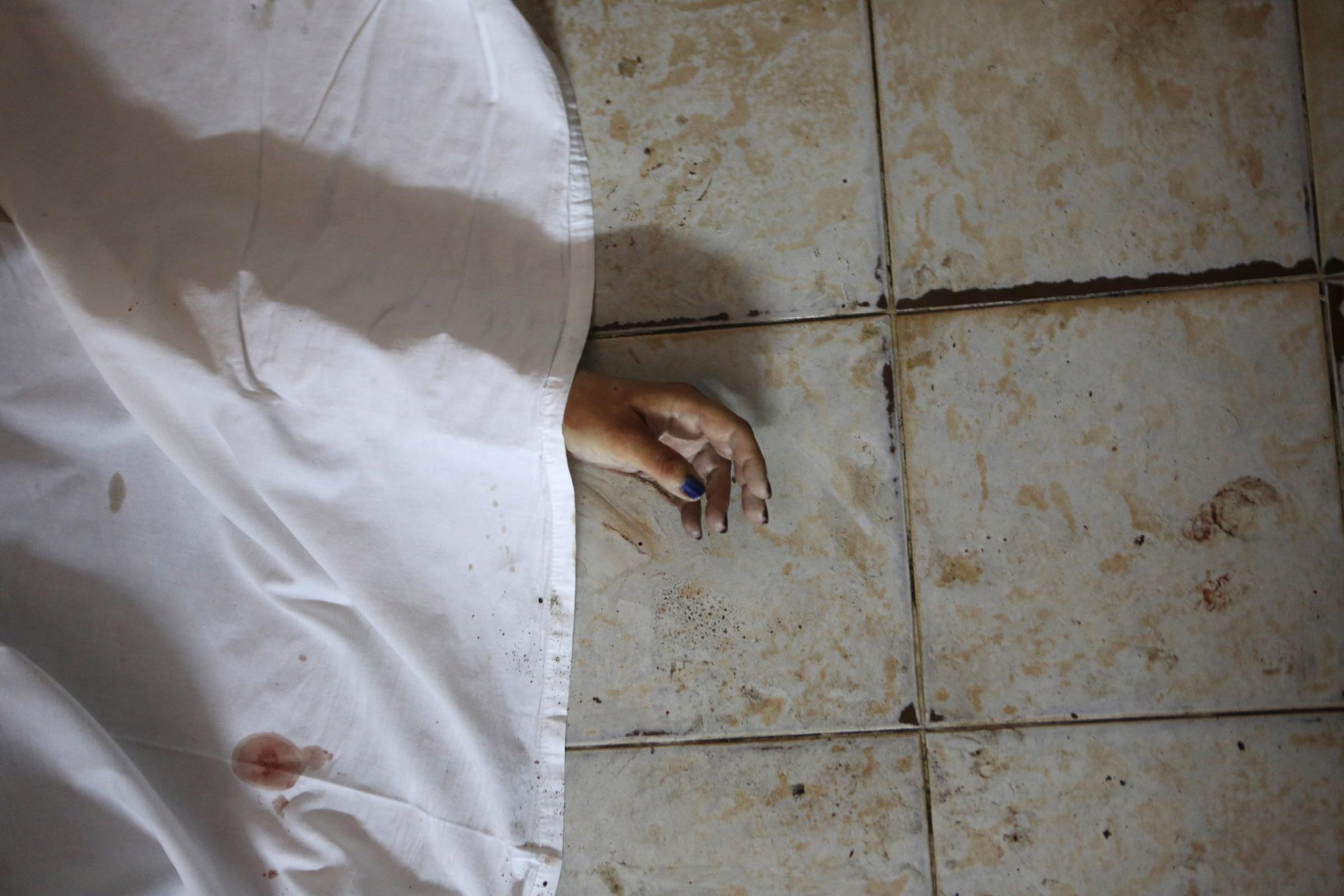 The hand of a person killed is seen after an attack in Grand Bassam