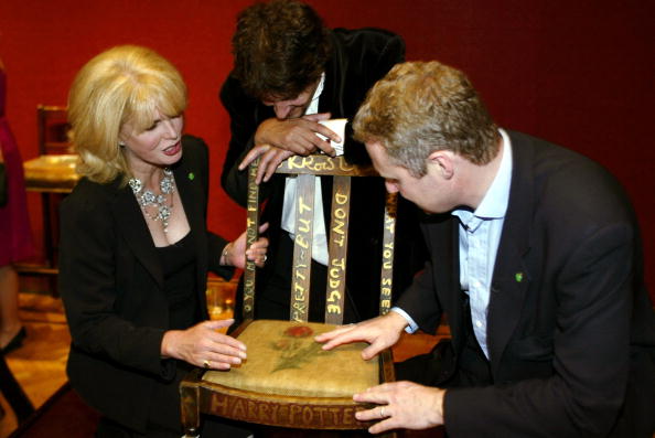 Actress Joanna Lumley (L), Miles Apthorp (C) and actor Rory Bremner (R) inspect the JK Rowling 'Harry Potter' chair at the Chairish the Child celebrity auction held at Christie's on September 4, 2002 in London, England.  Miles Apthorp made a winning bid for the chair. (Scott Barbour/Getty Images)