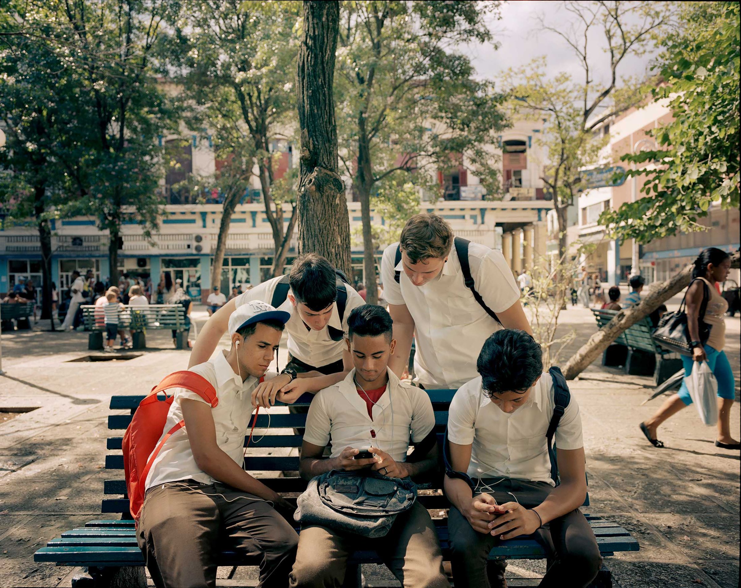 Young people gather at a Havana city park, where there is a Wi-Fi hotspot.