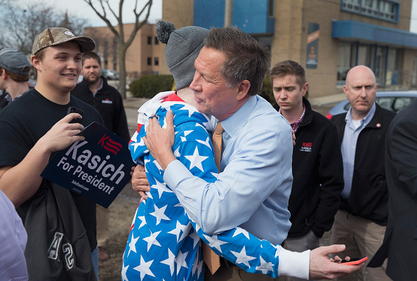 Republican presidential candidate Ohio Gov. John Kasich greets supporters following a rally at the Lansing Brewing Company on March 8, 2016 in Lansing, Michigan.
