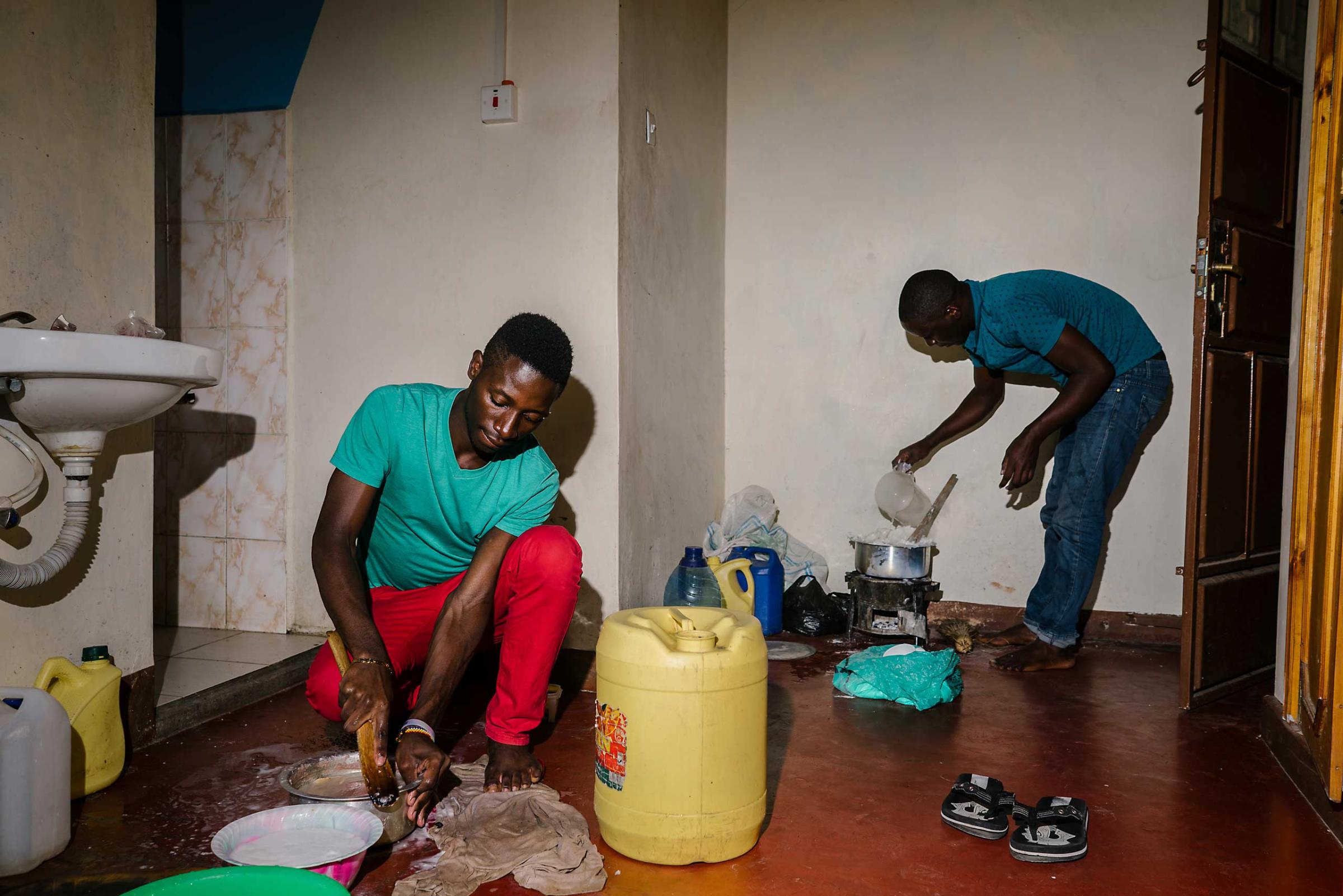 S. and J. prepare food for themselves and others in the house they lived in outside of Nairobi.