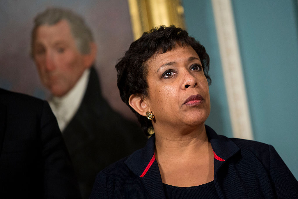 Attorney General Loretta Lynch looks on as President Barack Obama makes a statement after meeting with his National Security Council at the State Department on Feb. 25, 2016 in Washington, DC.