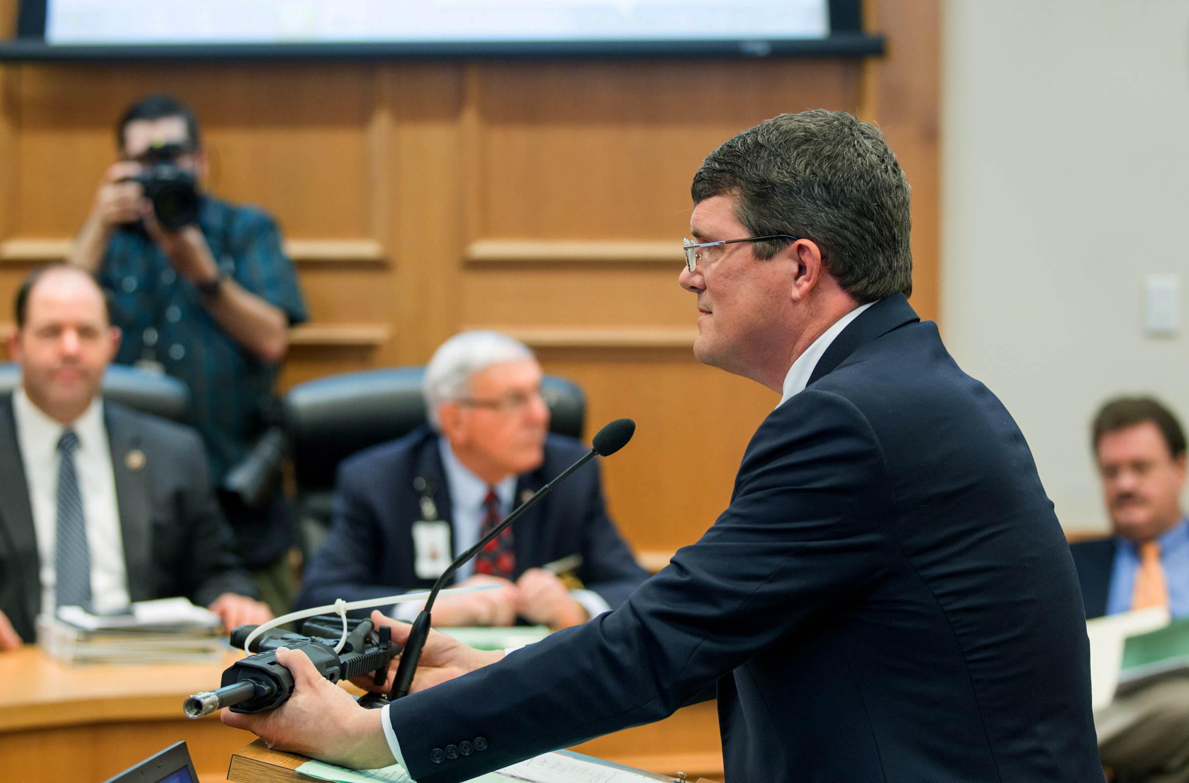 State Rep. Mike Stewart, D-Nashville, shows a gun he bought without a background check to the House Civil Justice subcommittee in Nashville, March 23, 2016. (Erik Schelzig—AP)