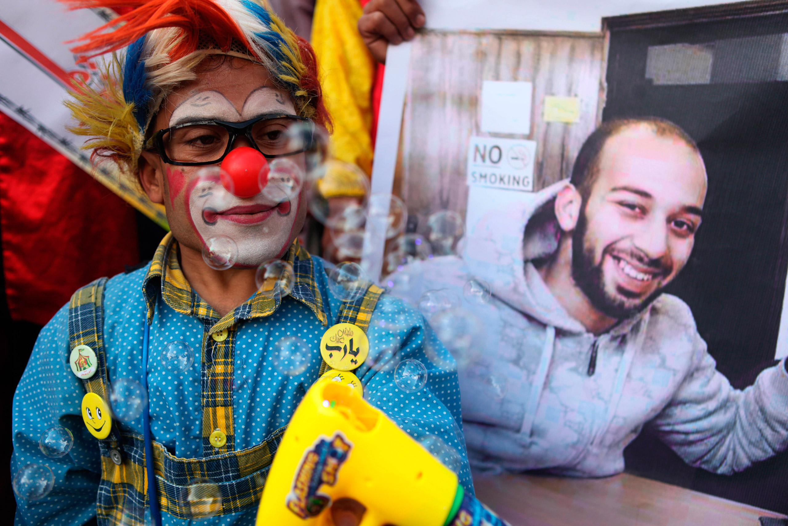 Palestinians clowns during a show of solidarity for their colleague, Mohammed Abu Sakha, who was jailed by Israel in December, in front of the Red Cross office in Gaza City, Feb. 8, 2016. (Majdi Fathi—NurPhoto/Sipa USA)