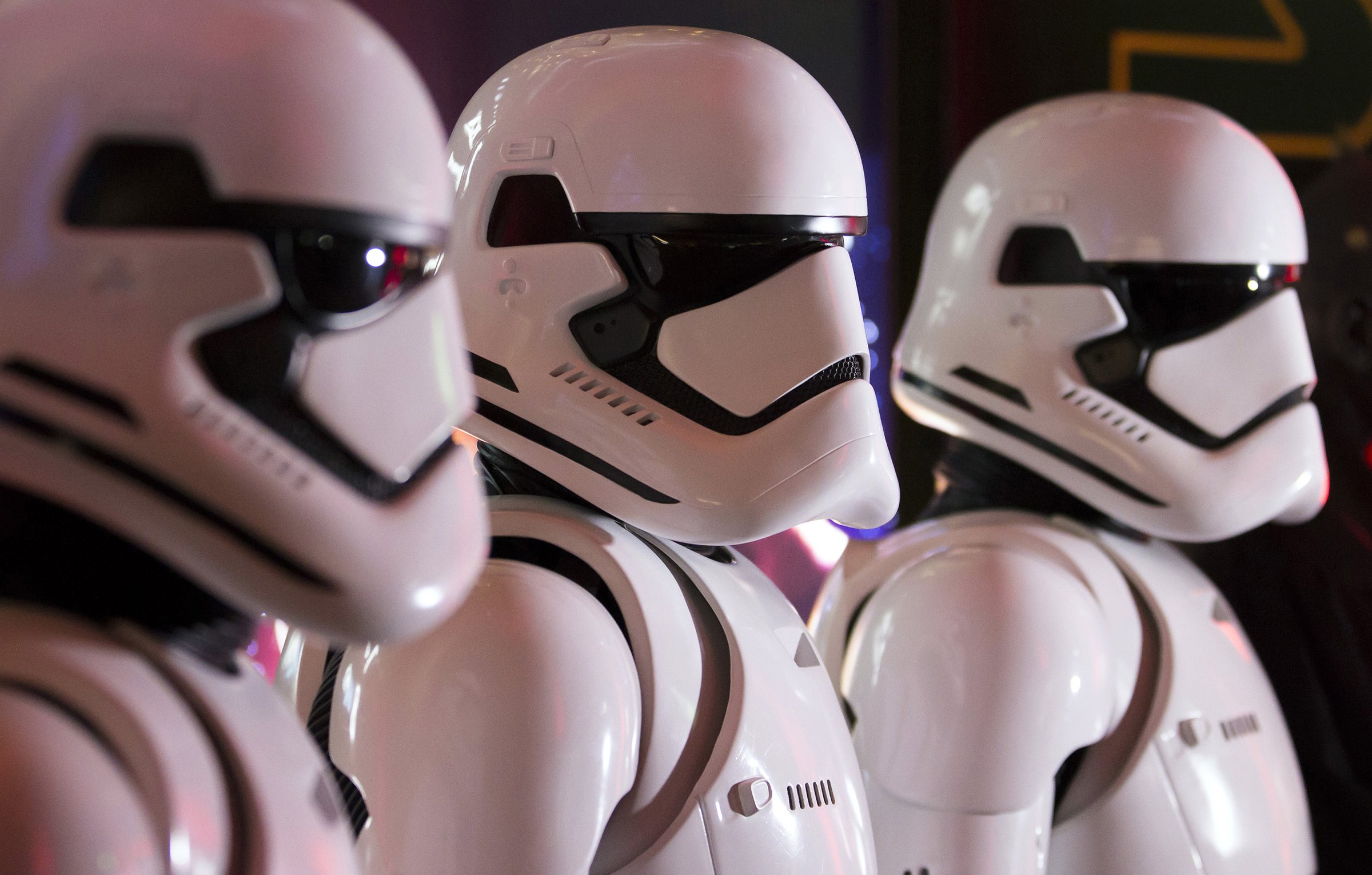 Fans wear Storm Trooper costumes ahead of the first public screening of Walt Disney Co.'s "Star Wars: The Force Awakens" at TOHO Cinemas Roppoing Hills in Tokyo, Japan, on Friday, Dec. 18, 2015.