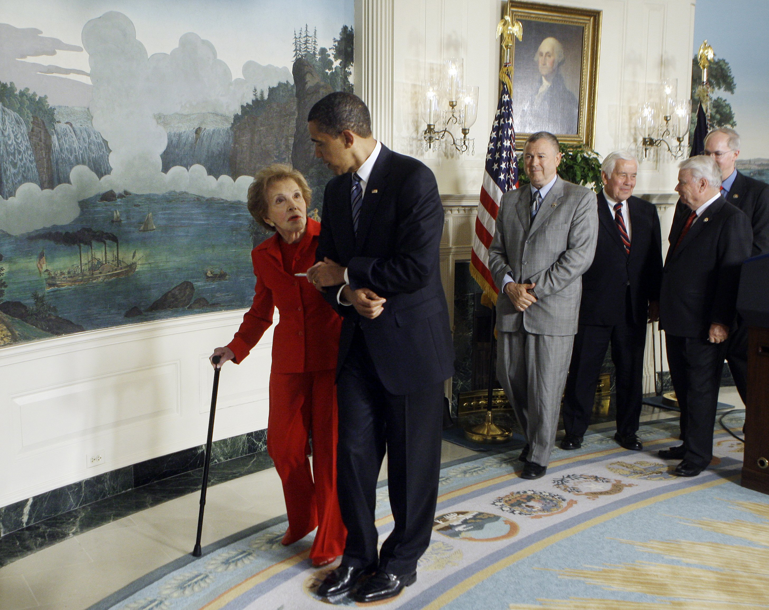 President Barack Obama escorts former first lady Nancy Reagan after signing the Ronald Reagan Centennial Commission Act, during a ceremony in the Diplomatic Reception Room of the White House in Washington, D.C. on June 2, 2009.