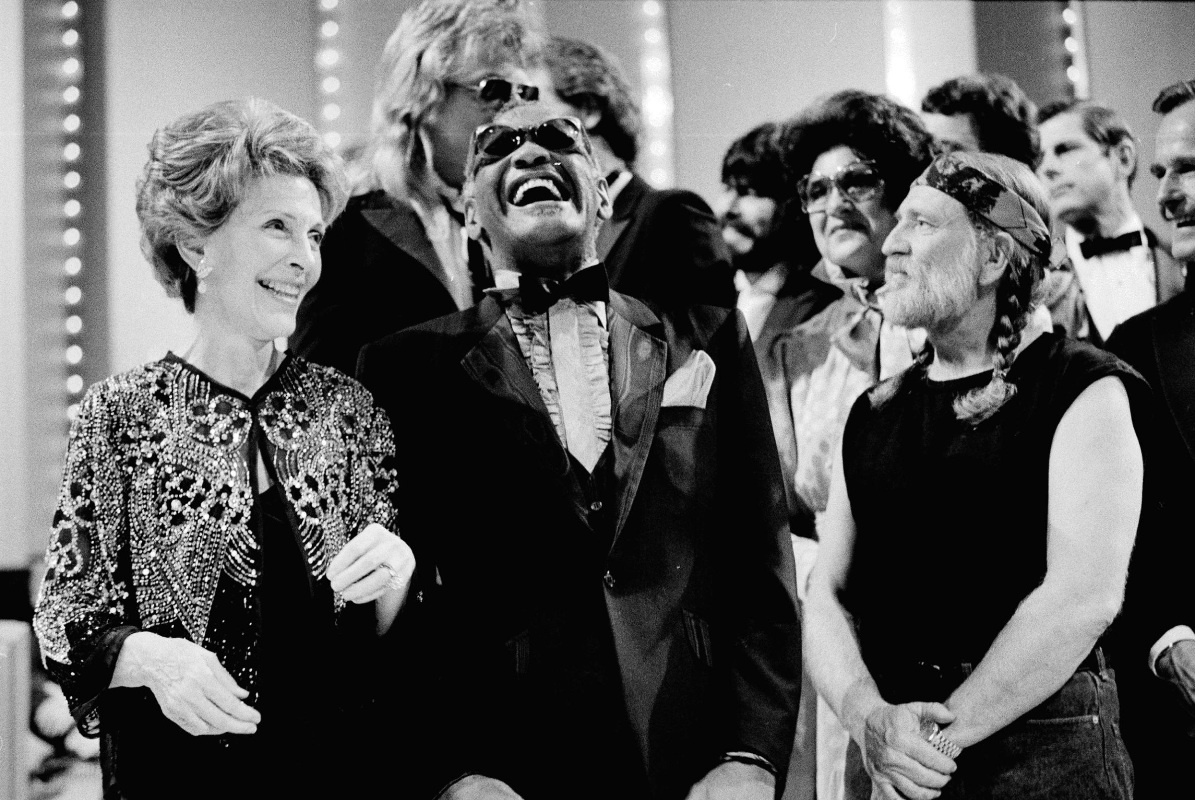 Nancy Reagan gets a laugh with Ray Charles and Willie Nelson and other entertainers at a salute to country music at Constitution Hall in Washington on March 16, 1983.