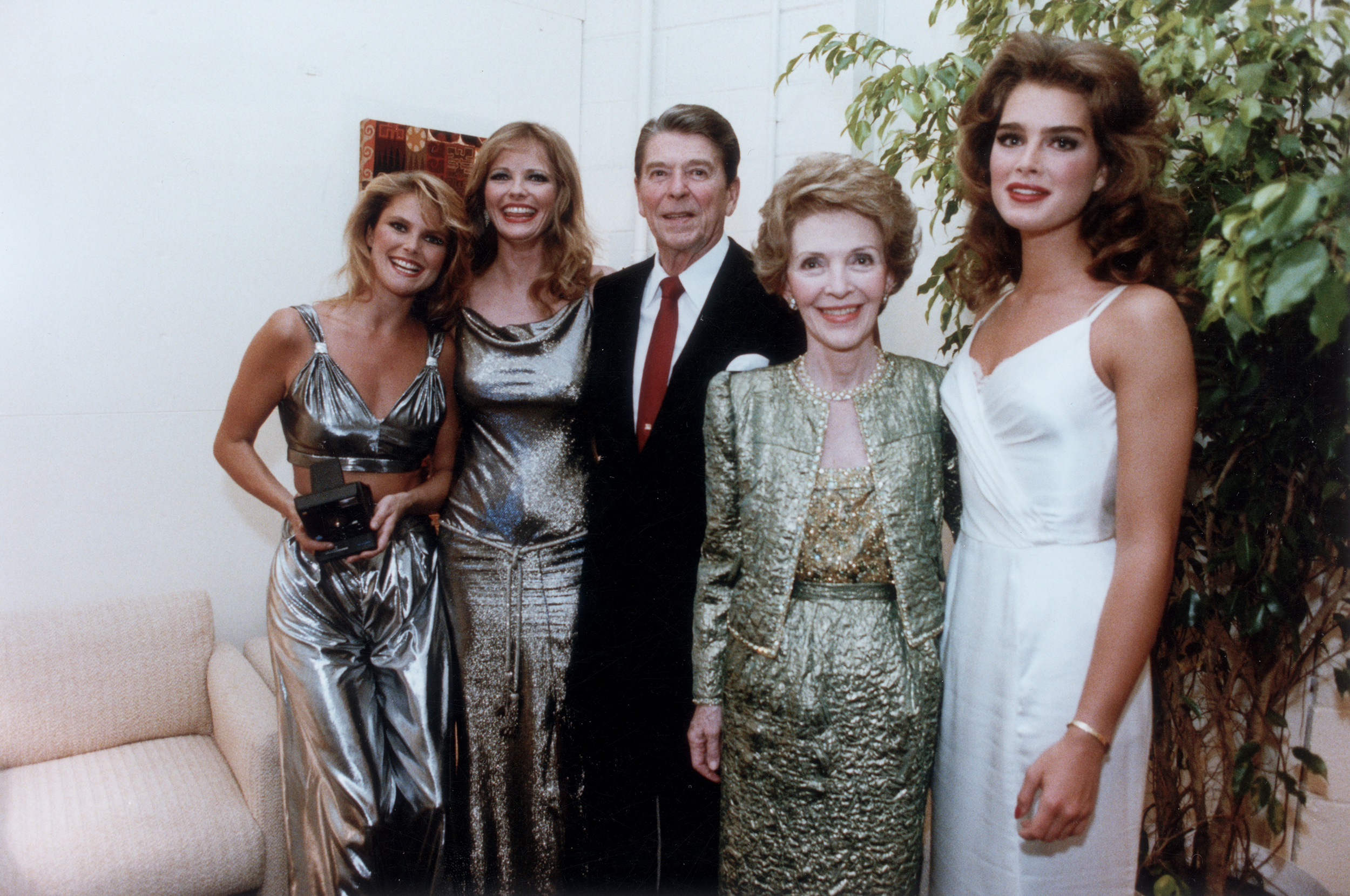 Ronald Reagan and Nancy Reagan pose with American models Christie Brinkley, Cheryl Tiegs and Brooke Shields backstage at the Bob Hope USO show on May 20, 1983.