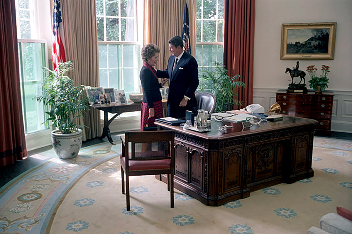 President Ronald Reagan and First Lady Nancy Reagan share a moment alone in the Oval Office on Sept. 16, 1981.