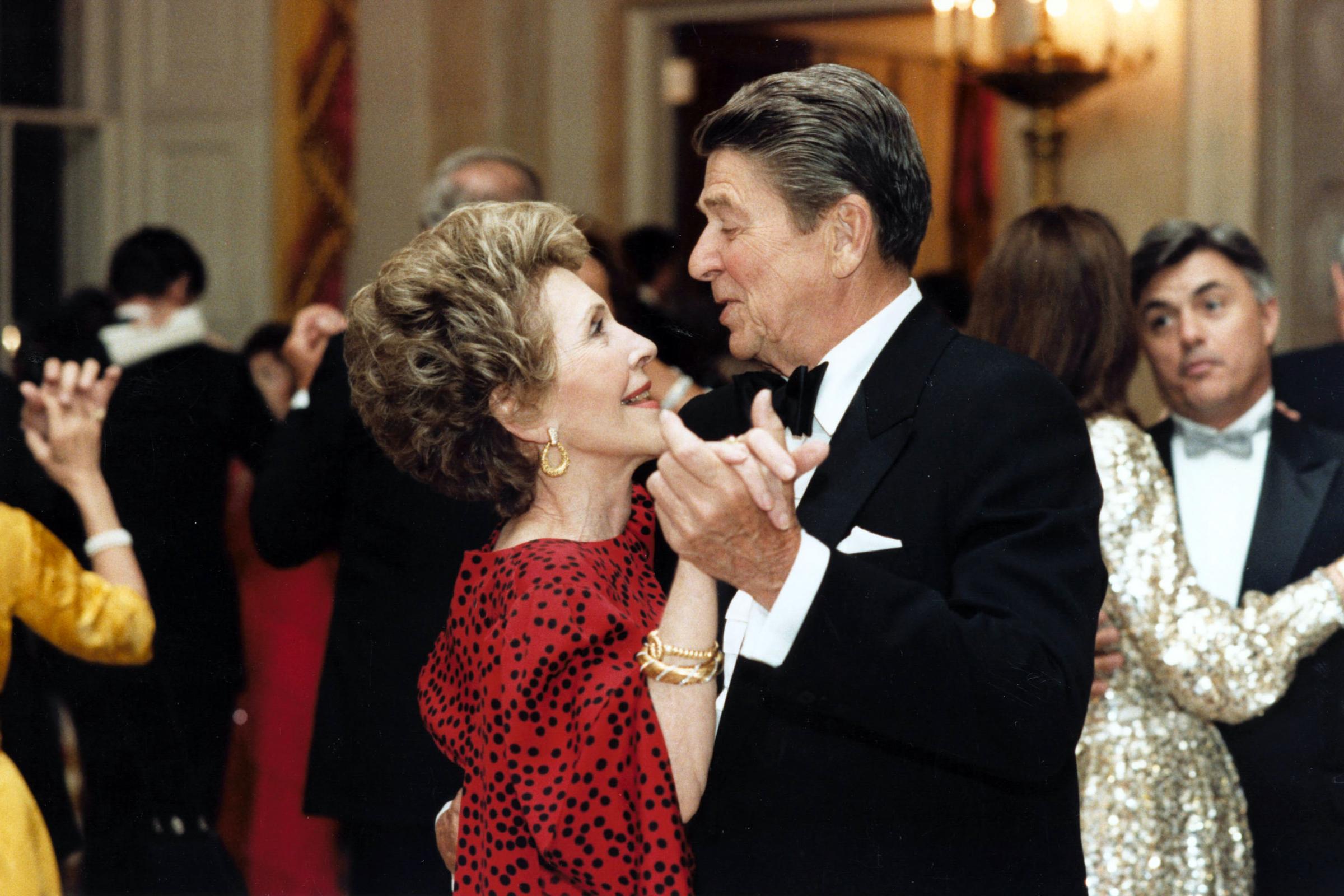 President Ronald Reagan dances with First Lady Nancy Reagan at the State Dinner for President Bendjedid of Algeria on April 17, 1985.