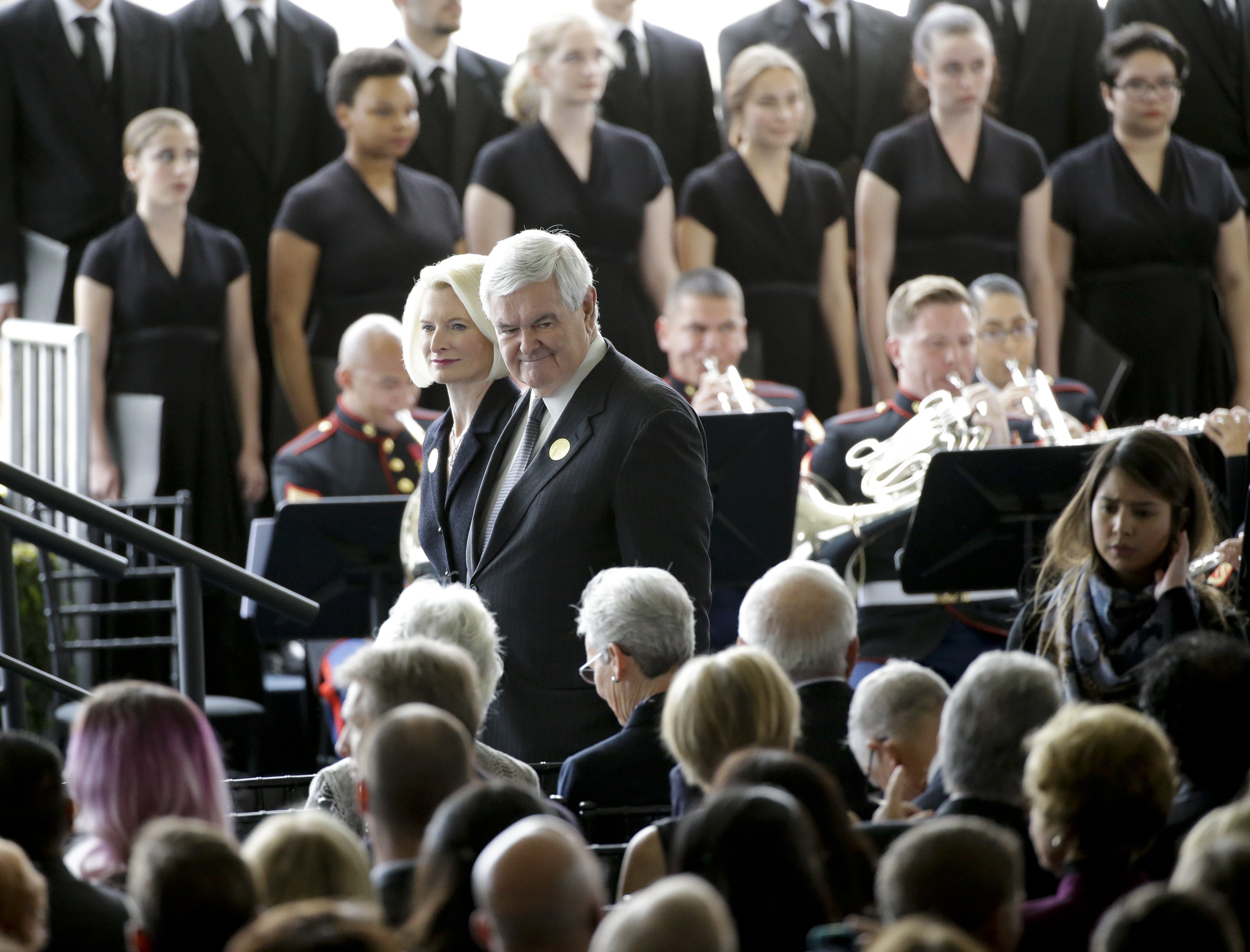 Newt, right, and Callista Gingrich arrive for the funeral service.