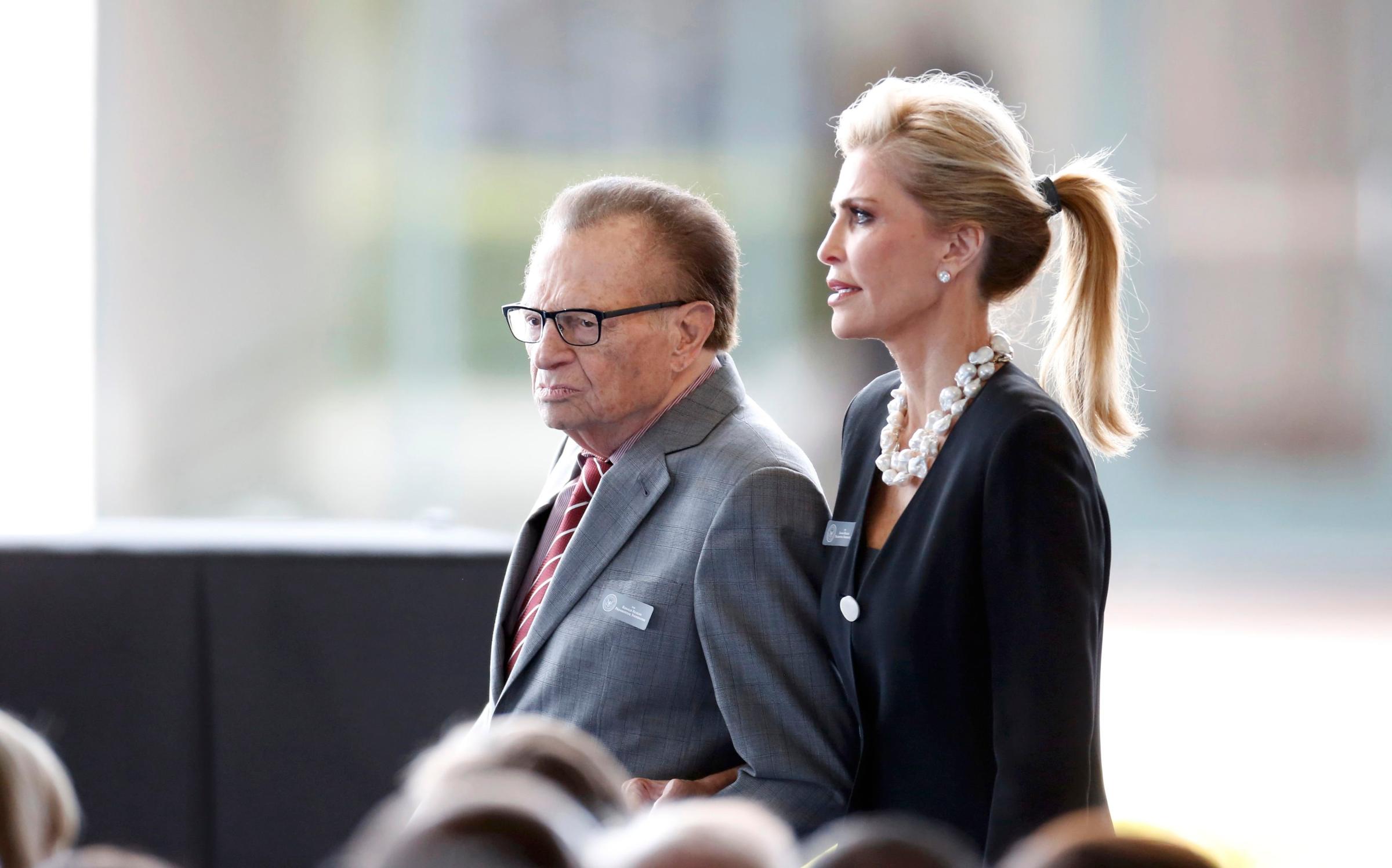 Television personality Larry King and his wife Shawn arrive for the funeral of Nancy Reagan at the Ronald Reagan Presidential Library in Simi Valley, California