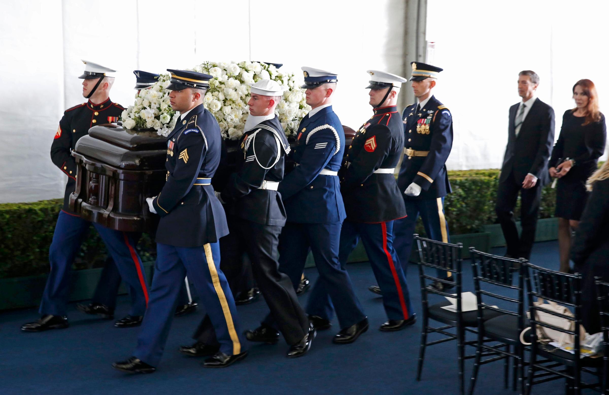 A military honor guard carries the casket after the funeral service for Nancy Reagan at the Ronald Reagan Presidential Library in Simi Valley, California