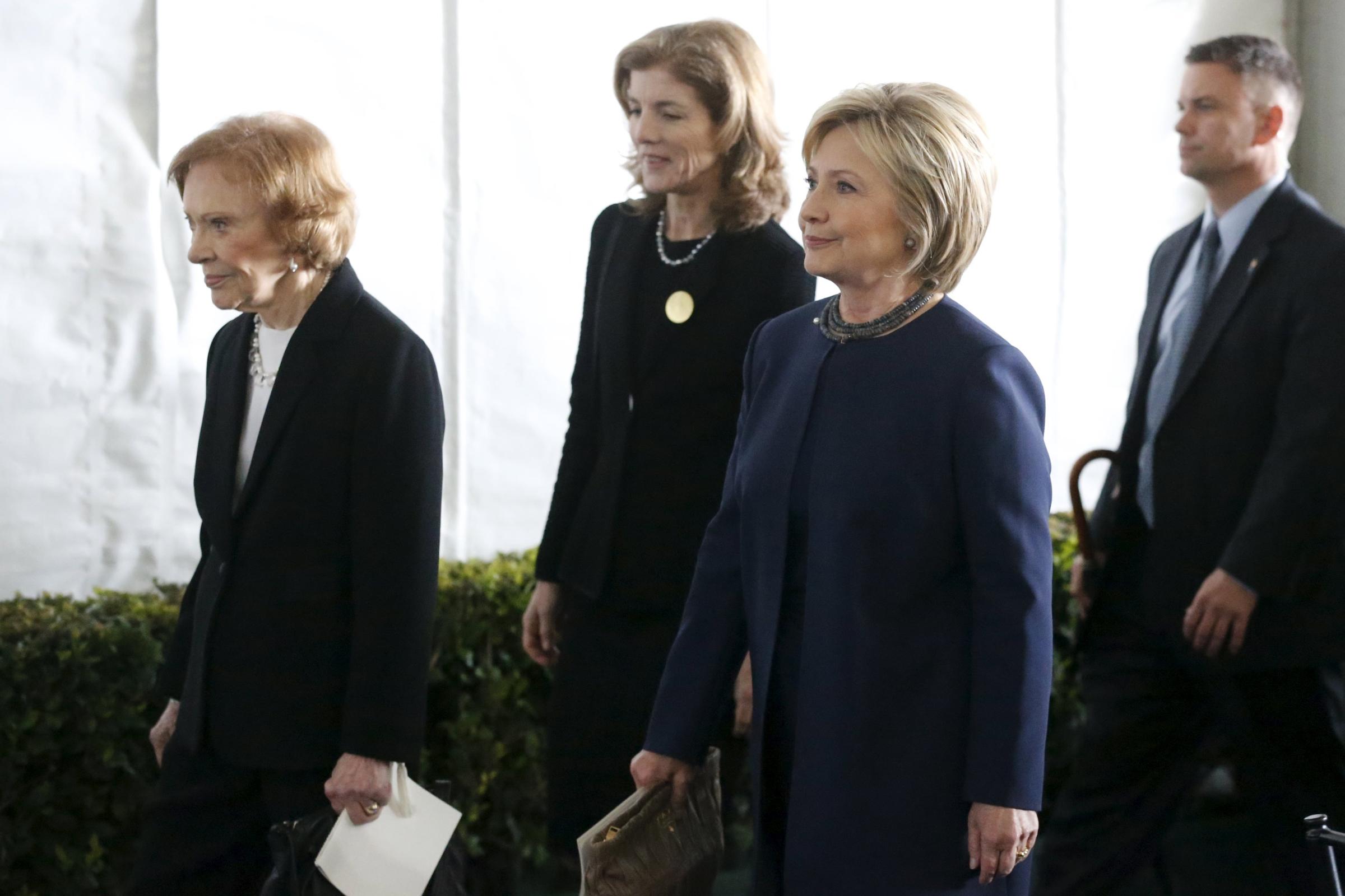 Former first lady Rosalynn Carter, Caroline Kennedy, and Hillary Clinton walk to the grave site after the funeral of Nancy Reagan at the Ronald Reagan Presidential Library in Simi Valley