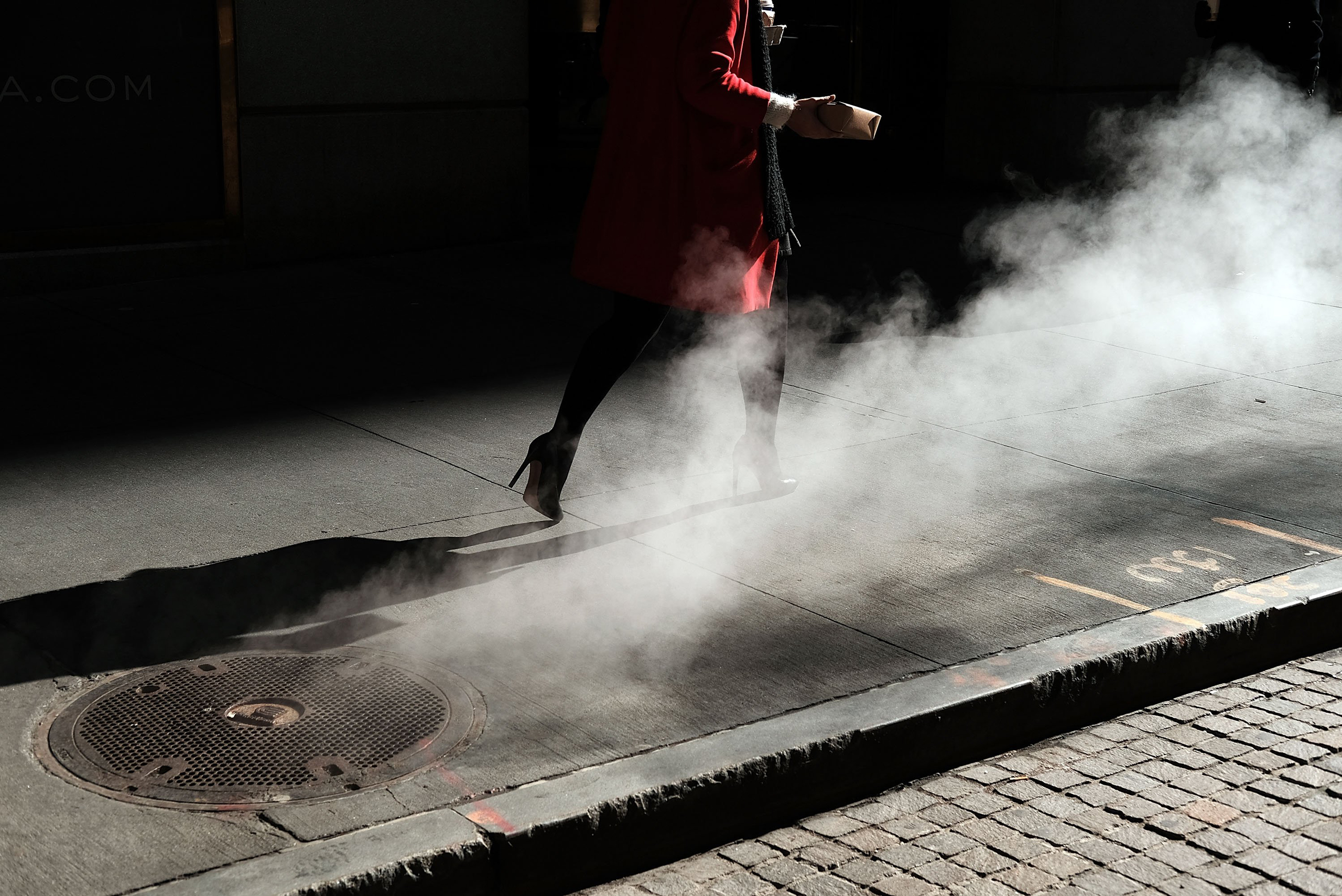 NEW YORK, NY - MARCH 21:  A woman walks by the New York Stock Exchange (NYSE) near Wall Street on March 21, 2016 in New York City. Following a strong week for US stocks, the Dow Jones industrial average was down slightly in morning trading.  (Photo by Spencer Platt/Getty Images) *** BESTPIX ***