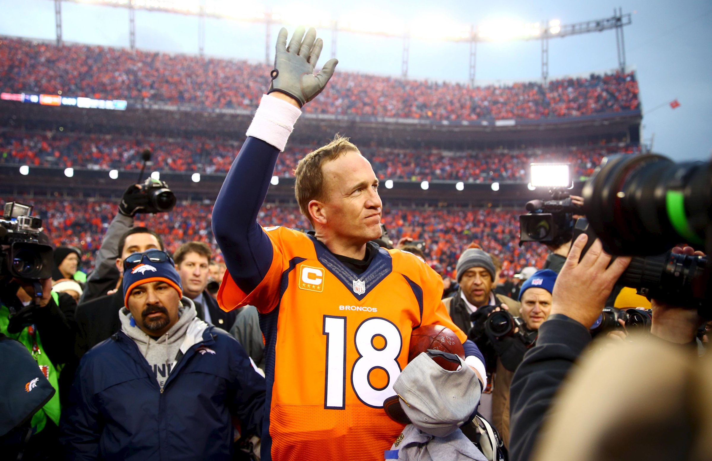 Denver Broncos quarterback Peyton Manning waves to the crowd after the AFC Championship football game against the New England Patriots at Sports Authority Field at Mile High in Denver, CO on Jan 24, 2016.