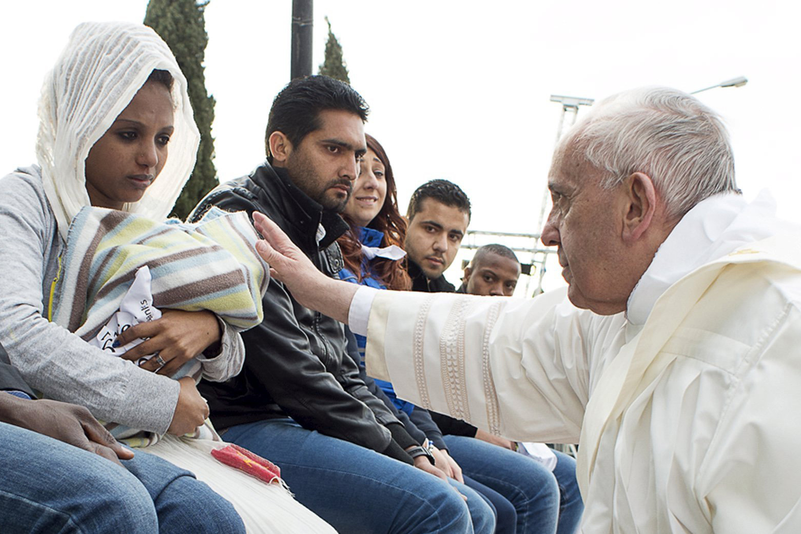 Pope Francis blesses a baby during the foot-washing ritual at the Castelnuovo di Porto refugees center near Rome, Italy, on March 24, 2016.