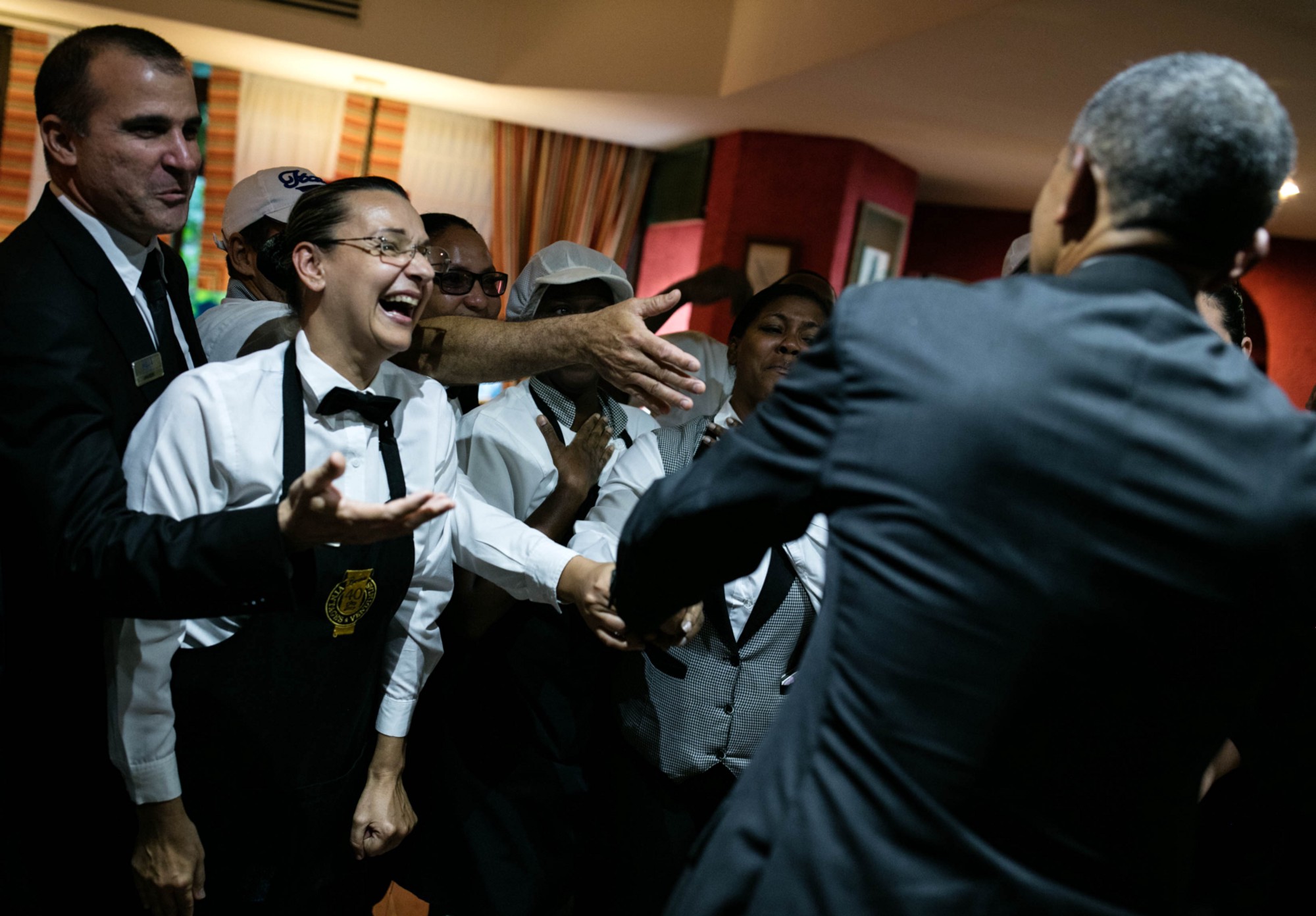 This photo released by the White House shows President Barack Obama greeting hotel workers in Havana on March 20, 2016.