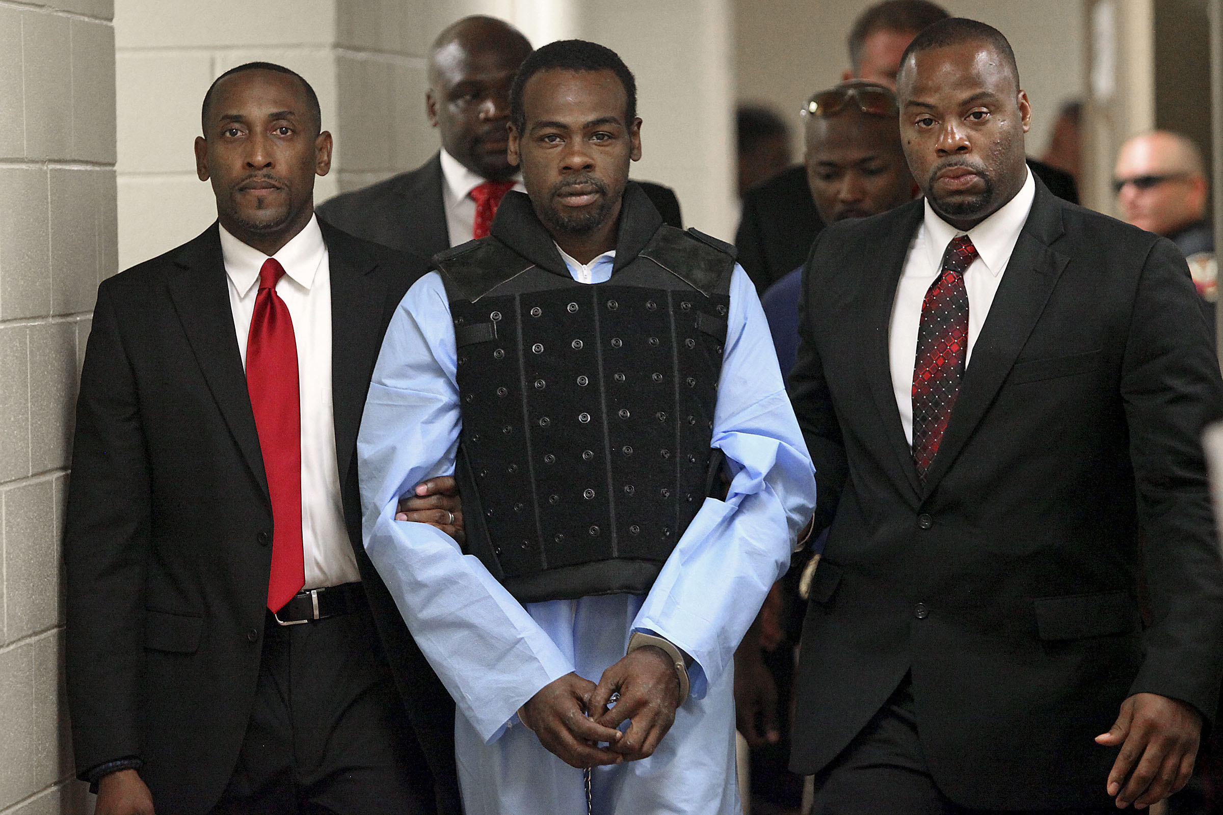 Rafael McCloud is escorted to a holding cell by police investigators in Vicksburg, Miss., on July 1, 2015. (Justin Sellers—AP)