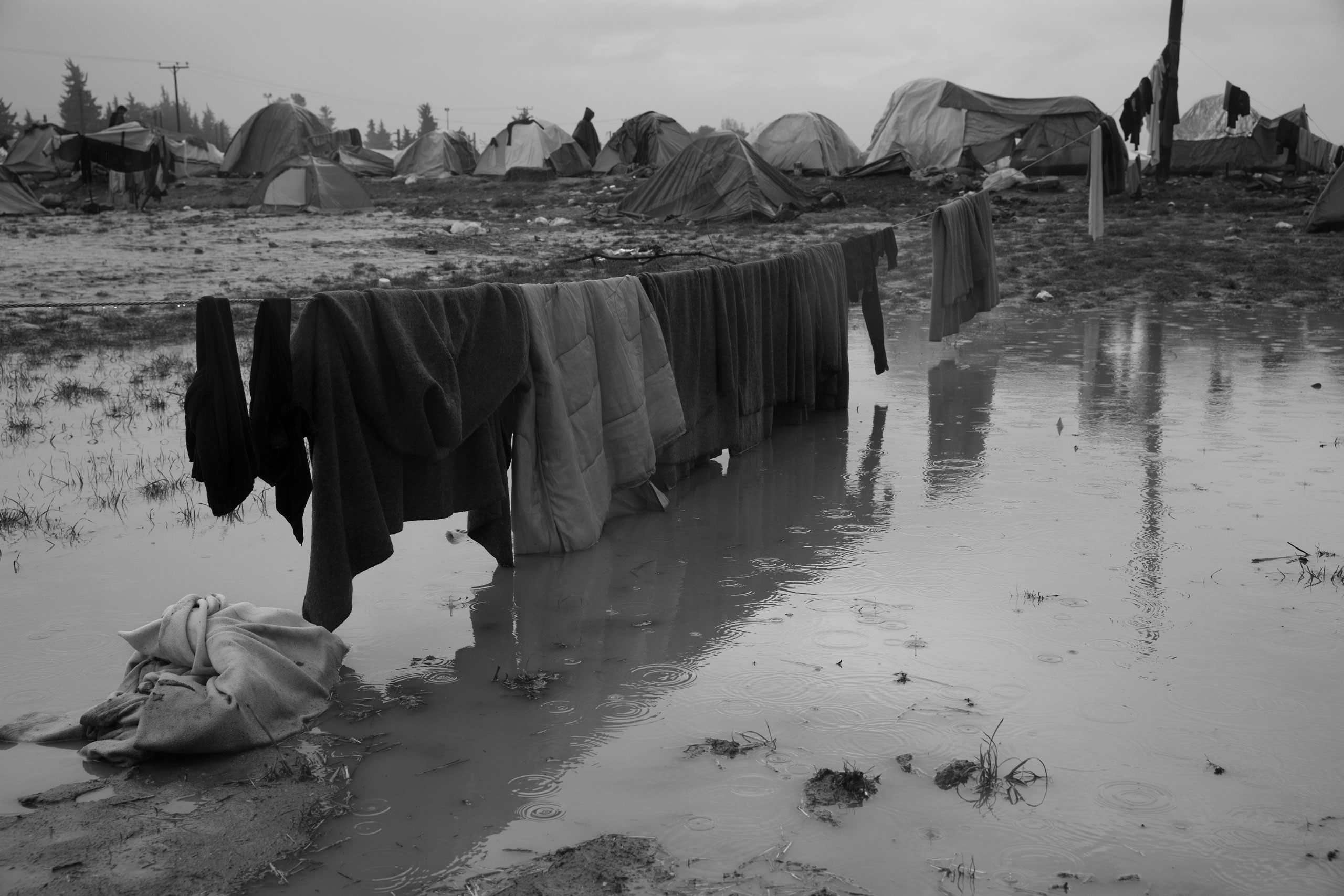 Laundry hangs on a line in the sprawling camp for refugees near the village of Idomeni, Greece at the border with Macedonia, where thousands are now stranded unable to make their way north, March 13, 2016.