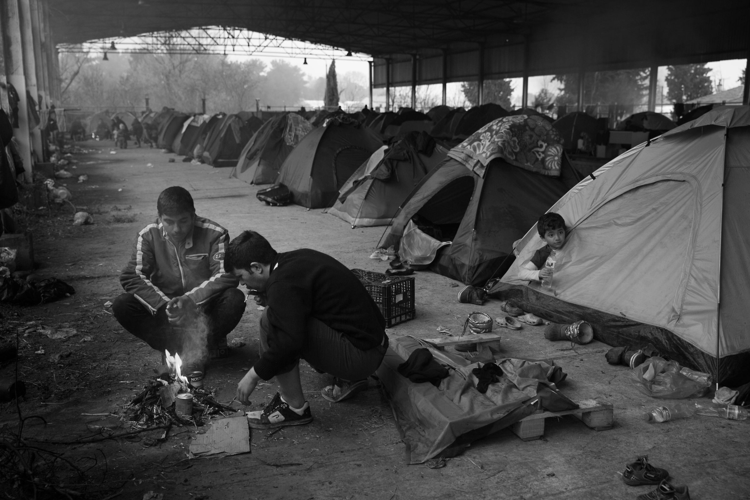 Tents line the inside of an old railway hangar near the town of Idomeni, Greece at the border with Macedonia. The refugees are being stopped from moving beyond Greece leaving thousands stranded in desperate conditions, March 13, 2016.