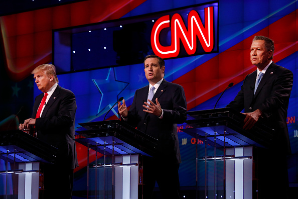 The four remaining Republican primary candidates Marco Rubio (not shown), Donald Trump, Ted Cruz, and John Kasich take part in a debate at the University of Miami on March 10, 2016, hosted by CNN and the Washington Times.