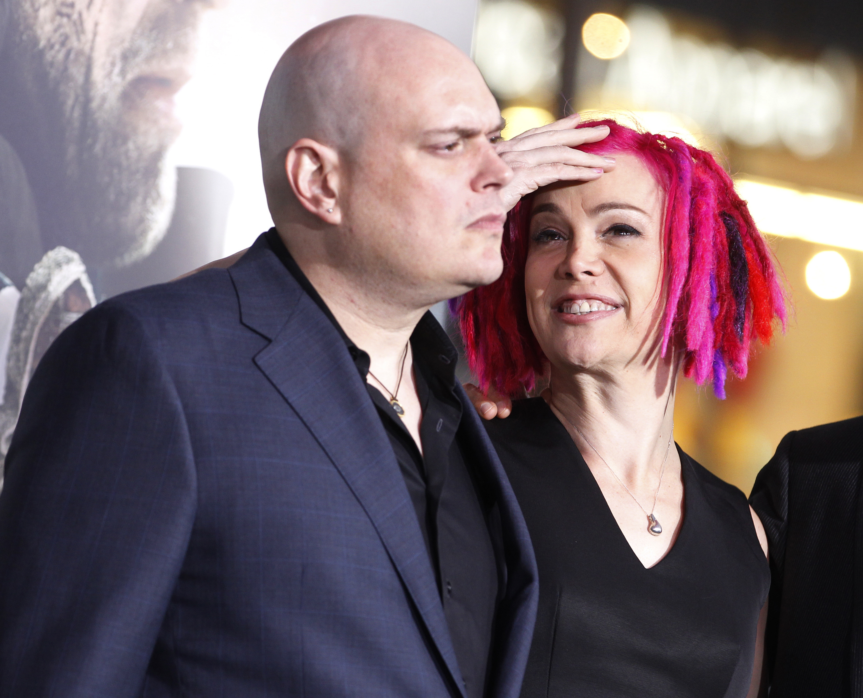 Lilly Wachowski prior to her transition, left, and sibling Lana Wachowski, the screenwriters, producers and directors of film <i>Cloud Atlas</i>, pose as they arrive for the film's premiere on Oct. 24, 2012 (Fred Prouser—Reuters)