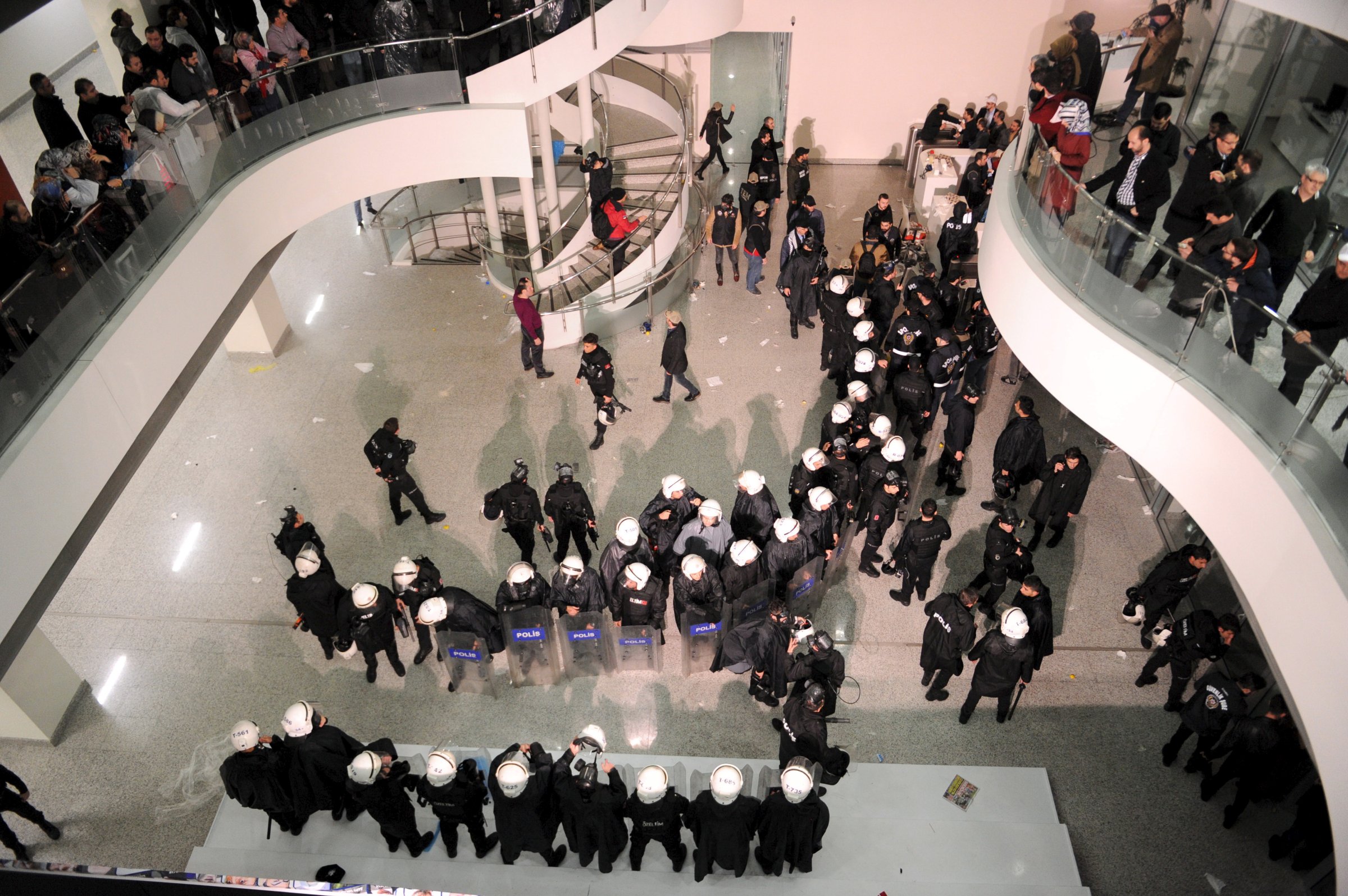 Riot police stand at the headquarters of Zaman newspaper in Istanbul