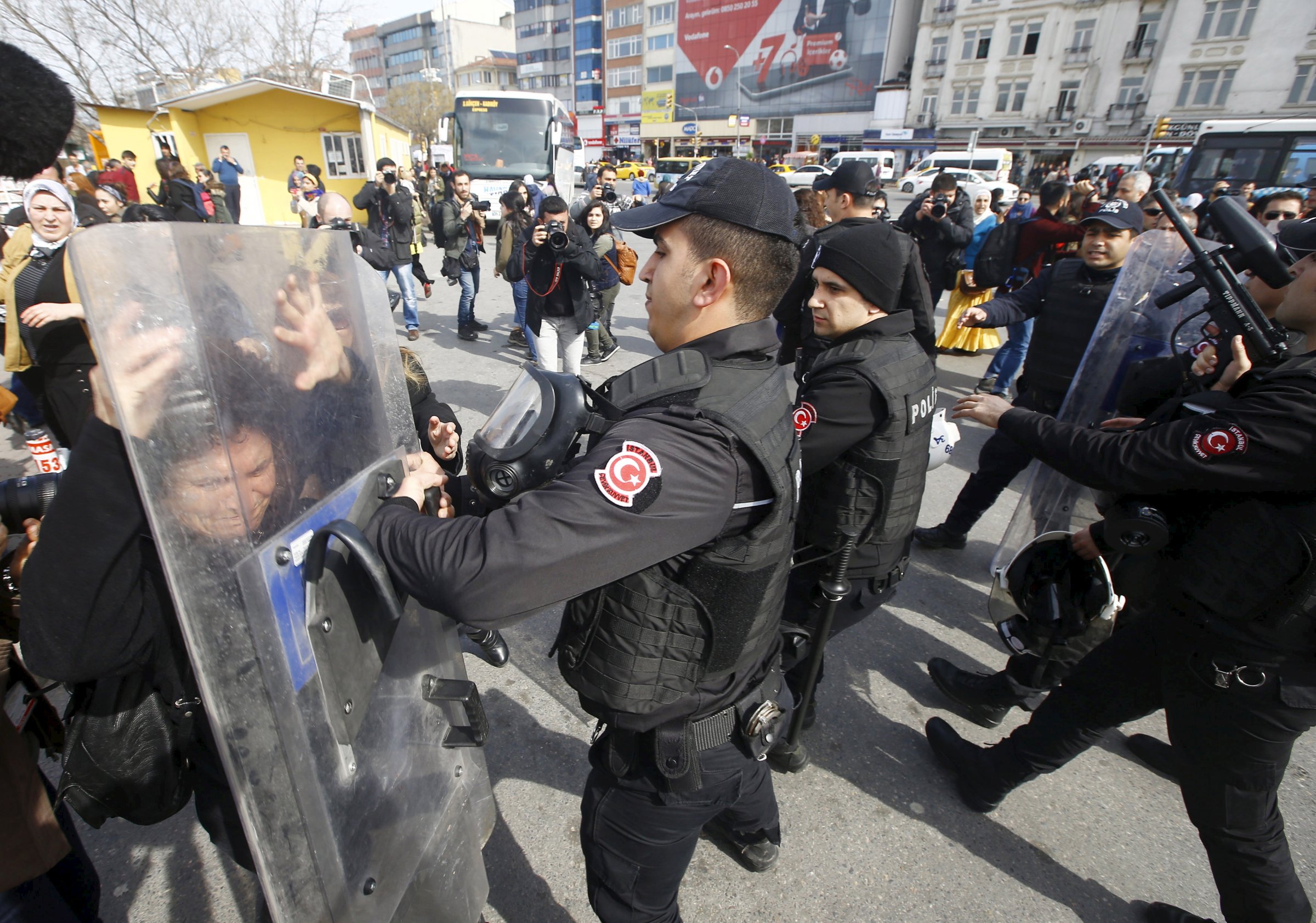 Demonstrators are stopped by the police during a protest ahead of the International Women's Day, in Istanbul
