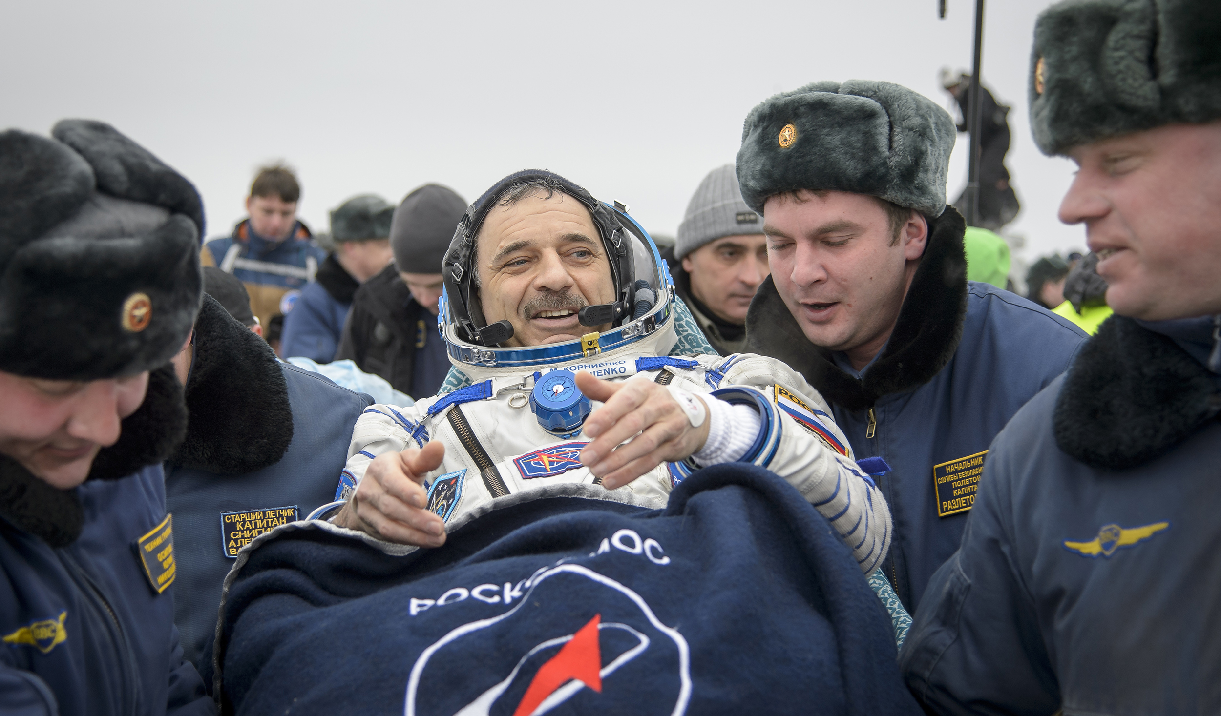 Russian cosmonaut Mikhail Kornienko of Roscosmos is carried into a medical tent after he, Scott Kelly and Sergey Volkov landed in their Soyuz TMA-18M spacecraft in a remote area on March 2, 2016 near the town of Zhezkazgan, Kazakhstan.
