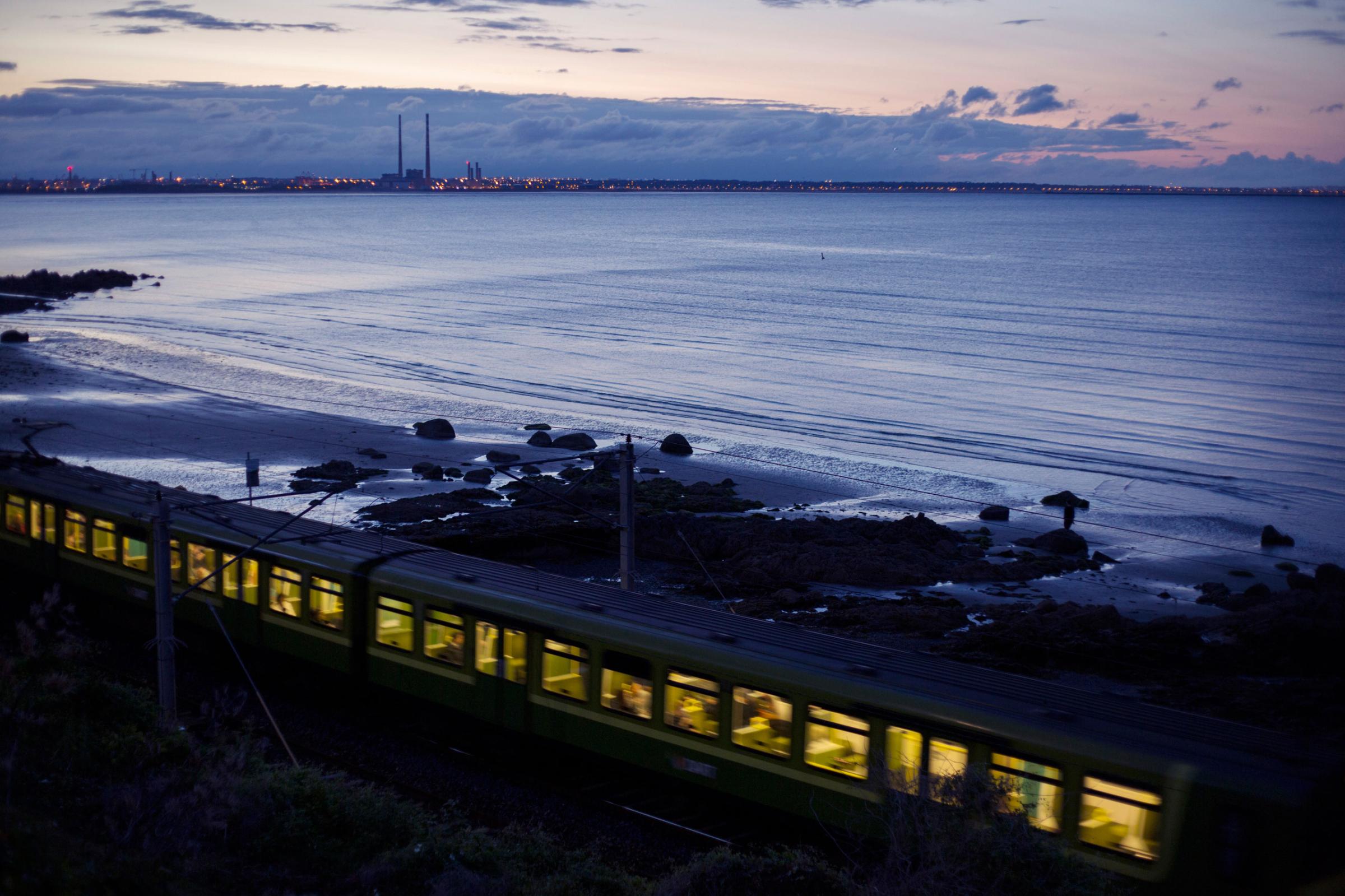 Co.Dublin A train passes by the sea at Monkstown.