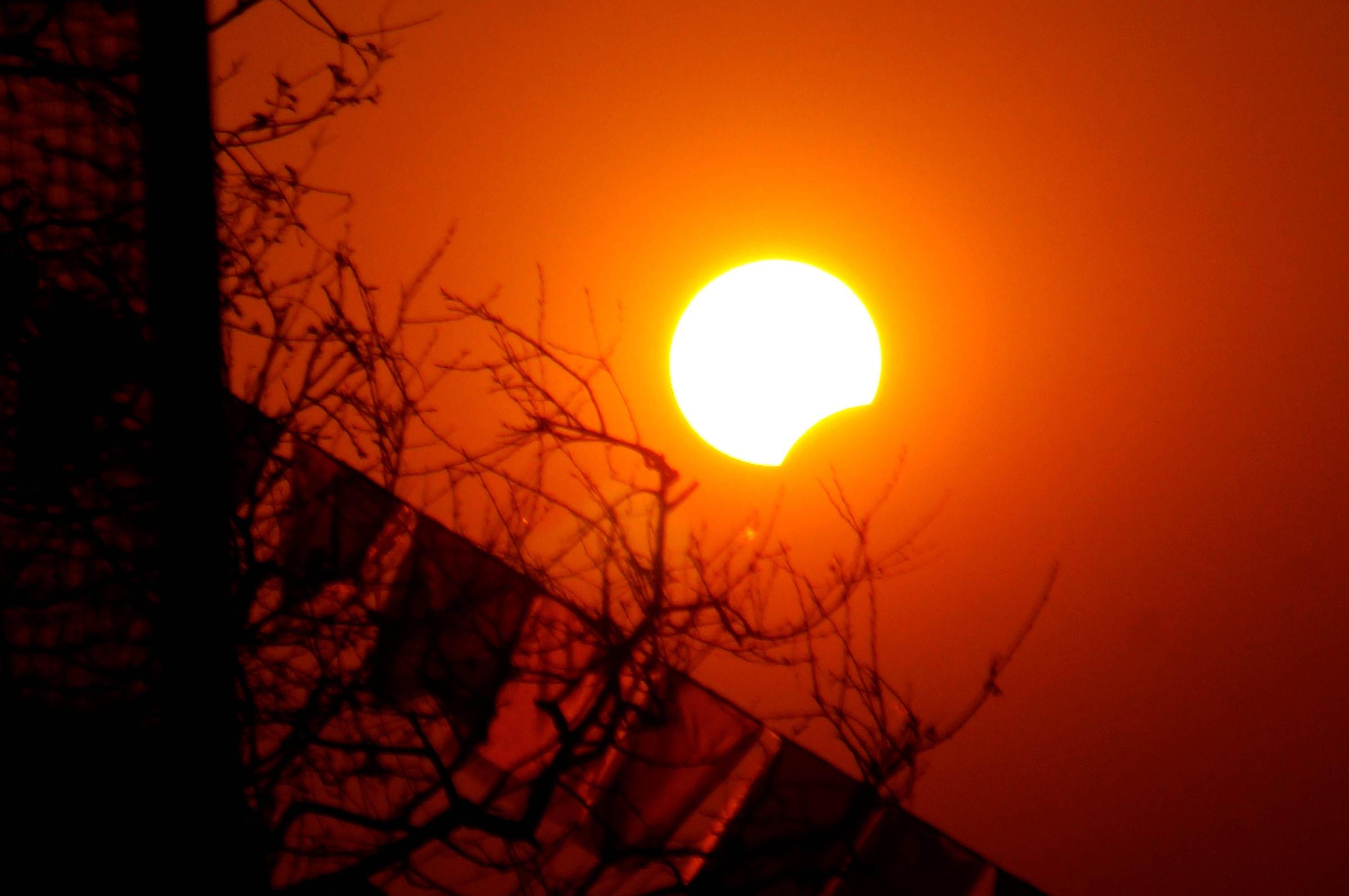 A partial solar eclipse is seen from Kathmandu, Nepal on March 9.