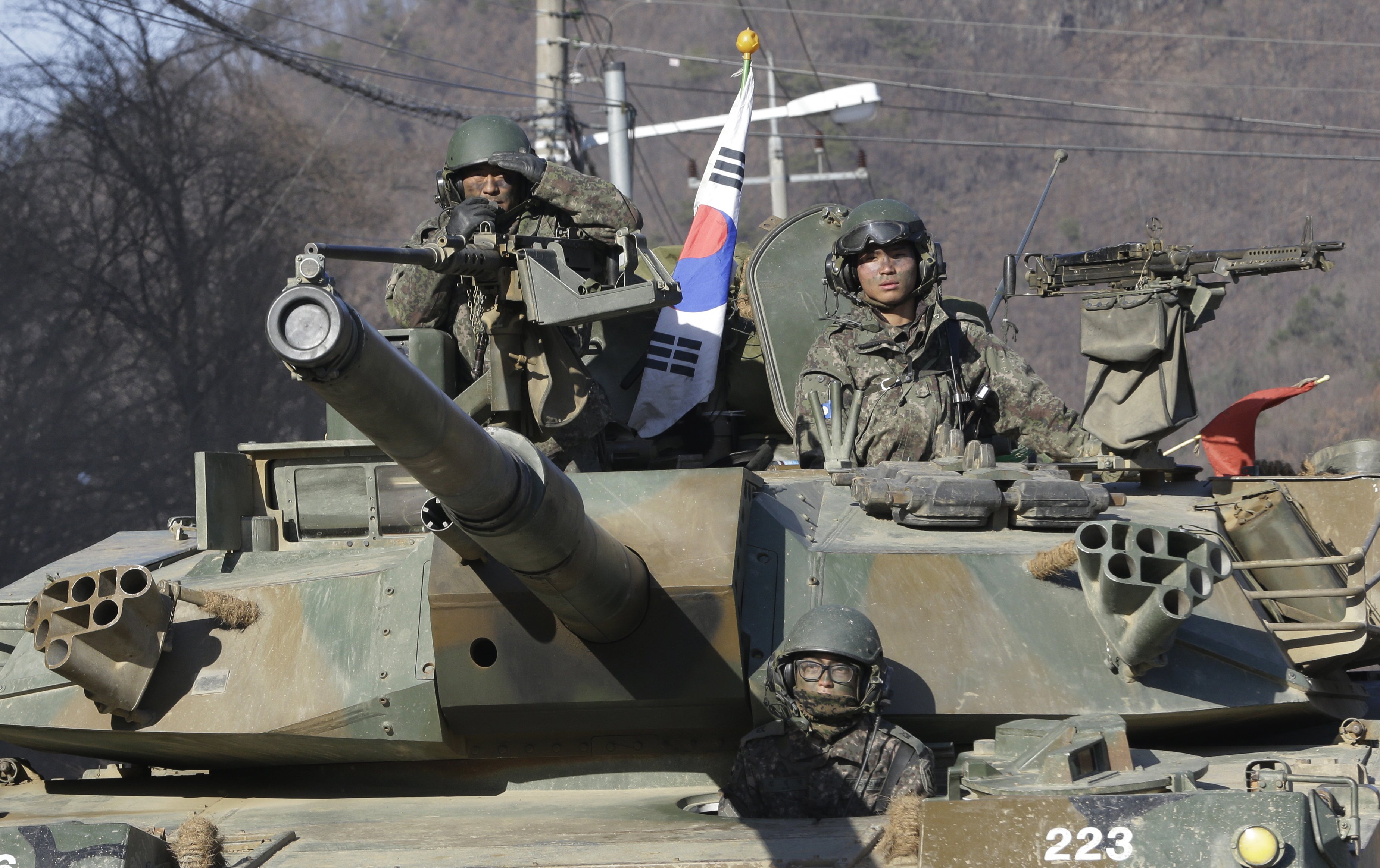South Korean army soldiers ride a K-1 tank during the annual exercise with their U.S. counterparts in Paju, near the border with North Korea, on March 10, 2016. (Ahn Young-joon—AP)