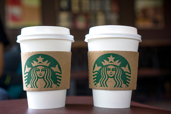 Coffee cups on the table in a Starbucks shop. (Zhang Peng/LightRocket via Getty Images)