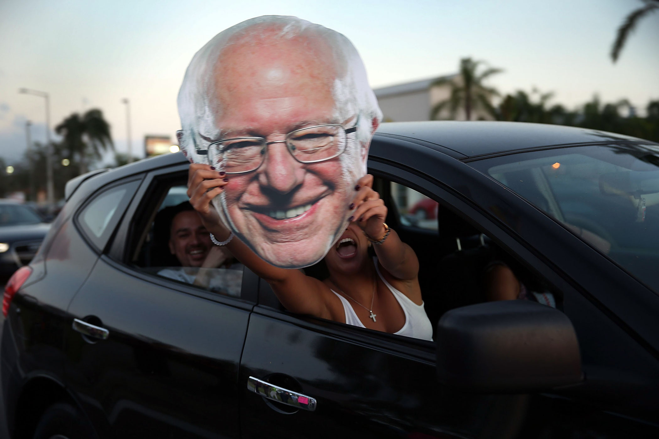 Supporters of Democratic presidential candidate, Vermont Sen. Bernie Sanders hold a cutout before a debate between Democratic presidential candidates Hillary Clinton and Bernie Sanders in Kendall, Fla. on March 9.