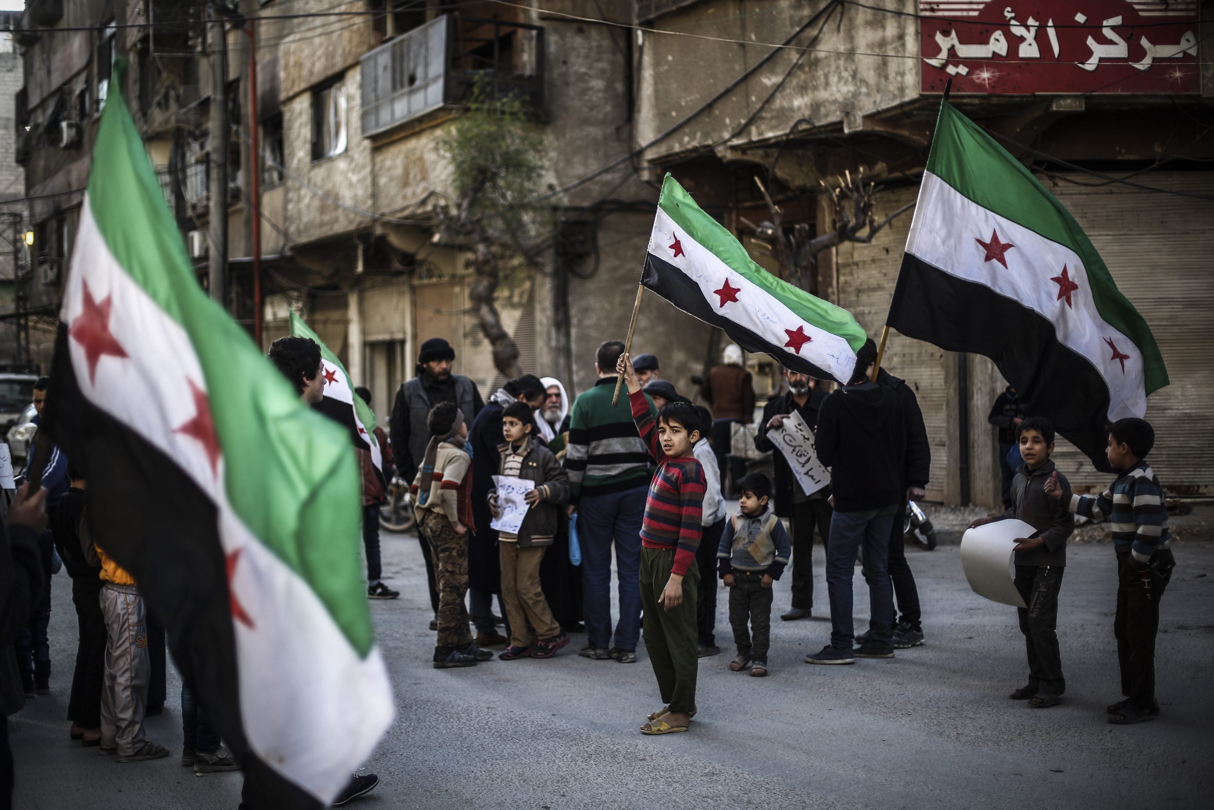 Syrians during a protest against the airstrikes which broke the Russian-US brokered ceasefire, in Douma, Syria, on March 11, 2016. (Mohammed Badra—EPA)