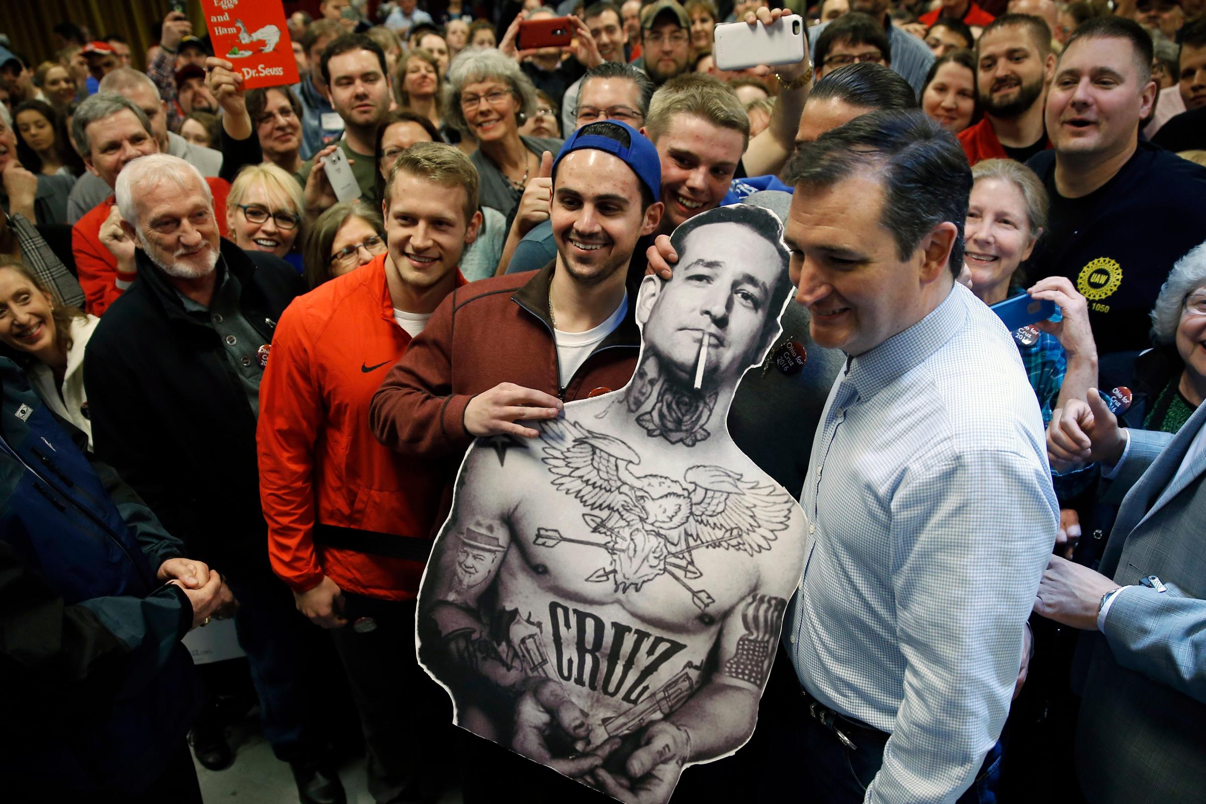 Republican presidential candidate, Texas Sen. Ted Cruz poses for photographs with a cut-out during a campaign stop on March 13 in Columbus, Ohio.