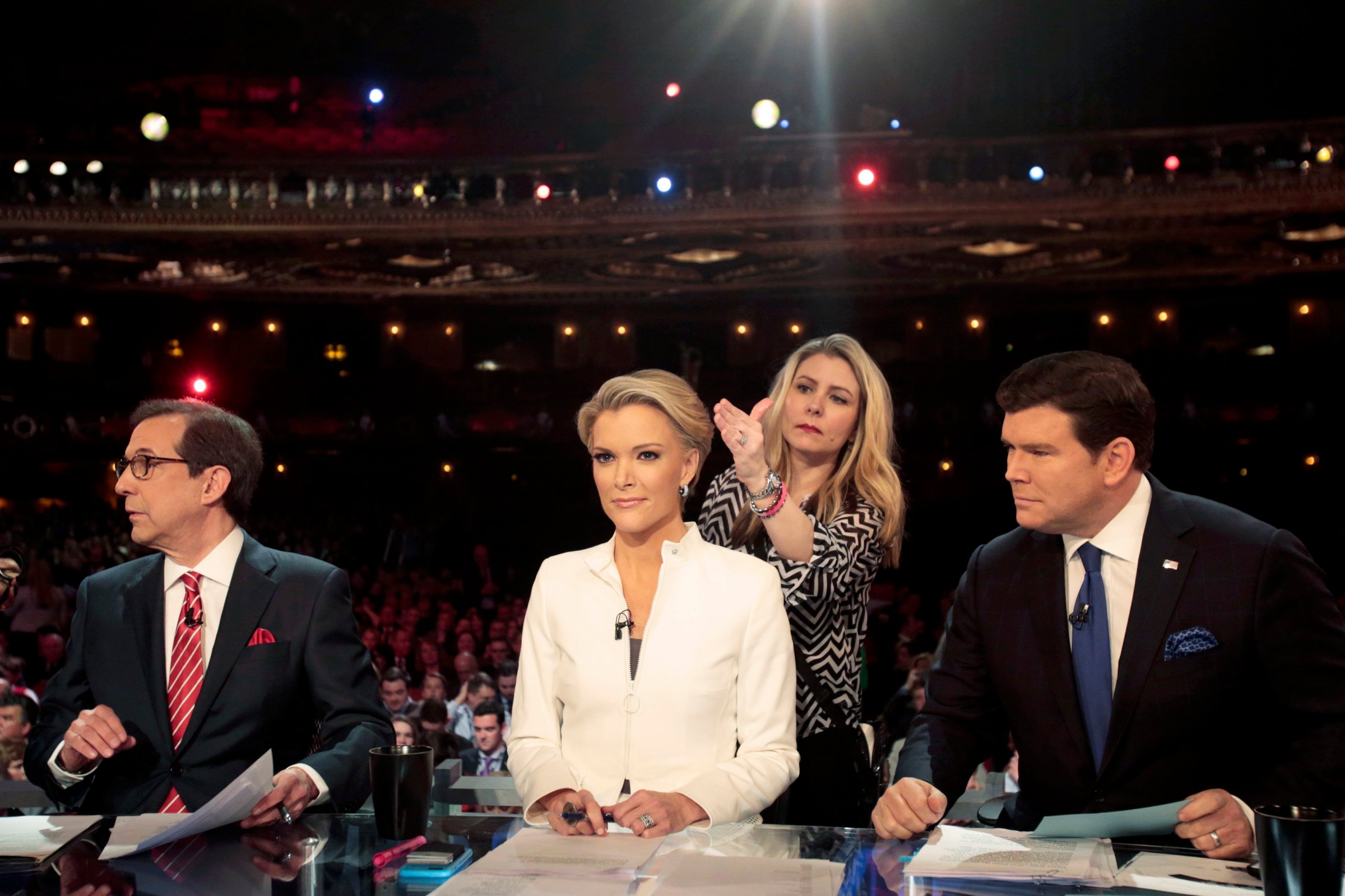 Fox News Channel anchors Wallace, Kelly and Baier prepare to moderate at the U.S. Republican presidential candidates debate in Detroit