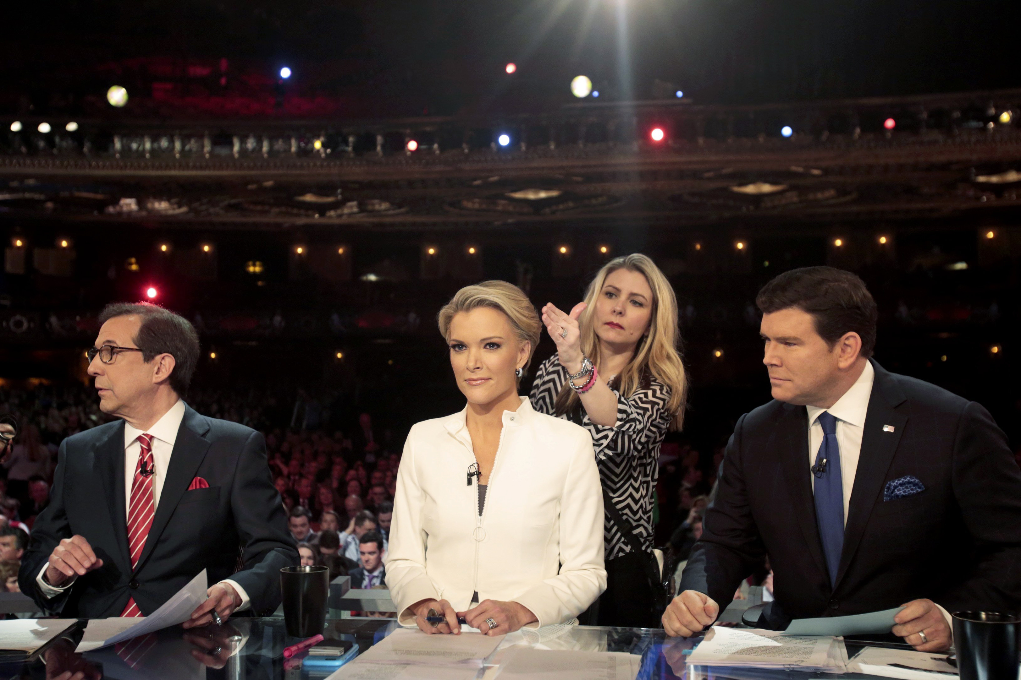 Fox News Channel anchors, from left, Chris Wallace, Megyn Kelly and Bret Baier moderate a debate in Detroit, on March 3. (Rebecca Cook—Reuters)