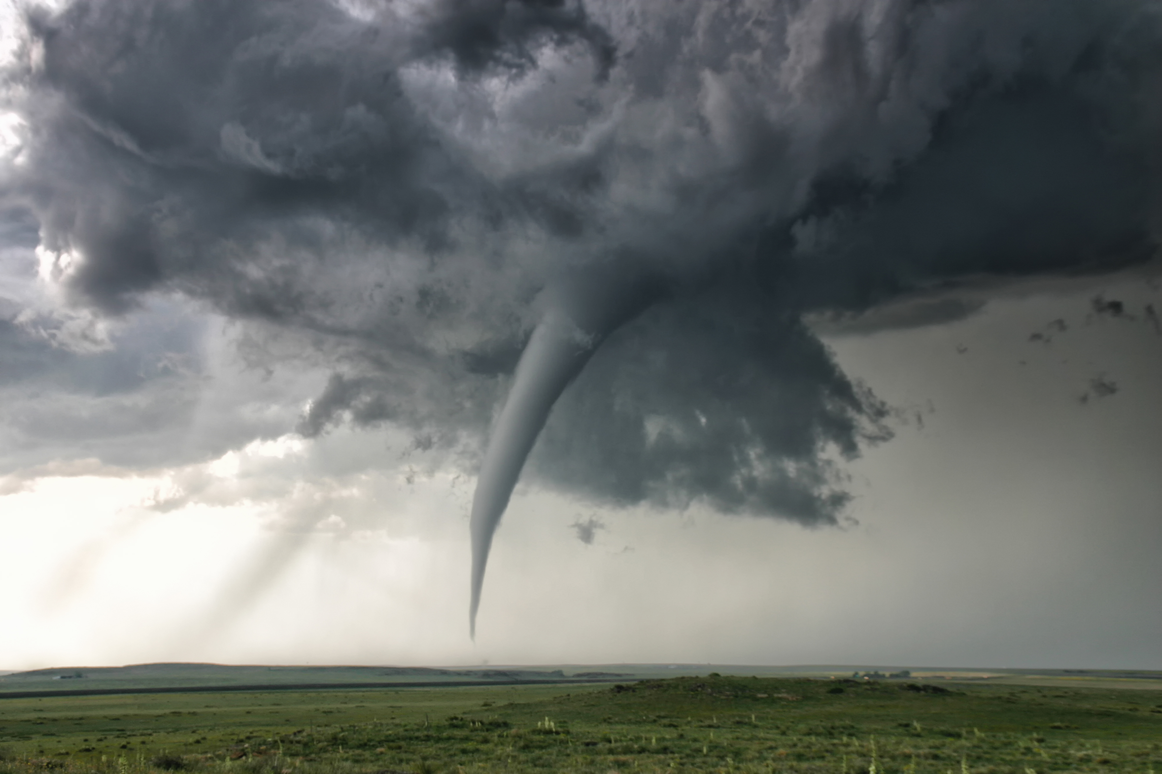 A perfectly needle-like cone tornado reaches out for the ground, Campo, Colorado, USA (Jason Persoff Stormdo—Getty Images/Cultura RM)