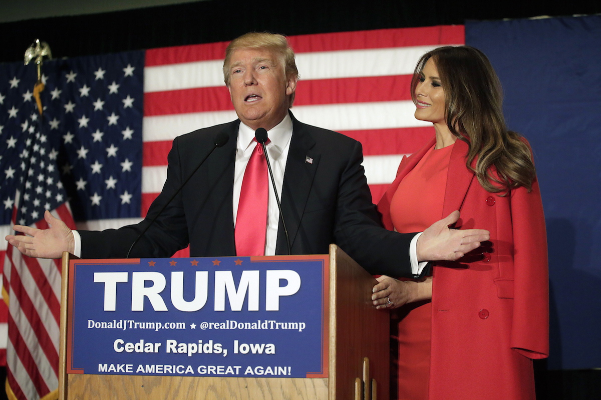 Republican presidential candidate Donald Trump speaks with his wife Melania Trump by his side during a campaign event at the U.S. Cellular Convention Center Feb., 2016 in Cedar Rapids, Iowa. (Joshua Lott—Getty Images)