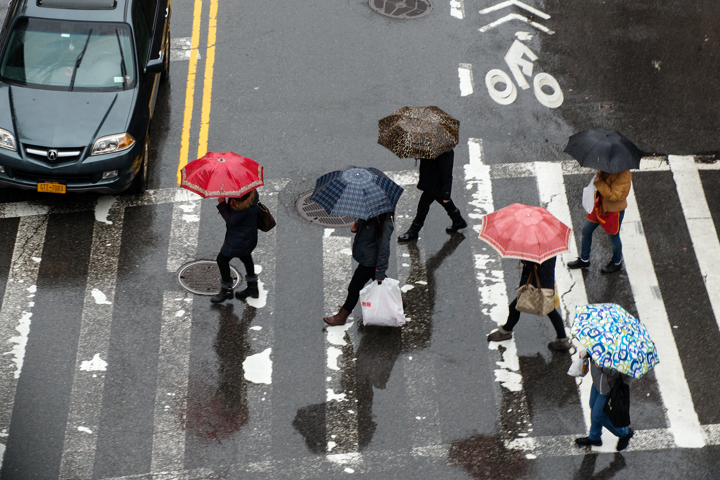 NEW YORK, NY - FEBRUARY 24: Pedestrians cross the street in Chinatown on February 24, 2016 in New York City.  According to the National Weather Service, as much as 1.5 inches of rain was expected throughout the day and a wind advisory was to begin at 6 pm. (Photo by Bryan Thomas/Getty Images) (Bryan Thomas&mdash;Getty Images)