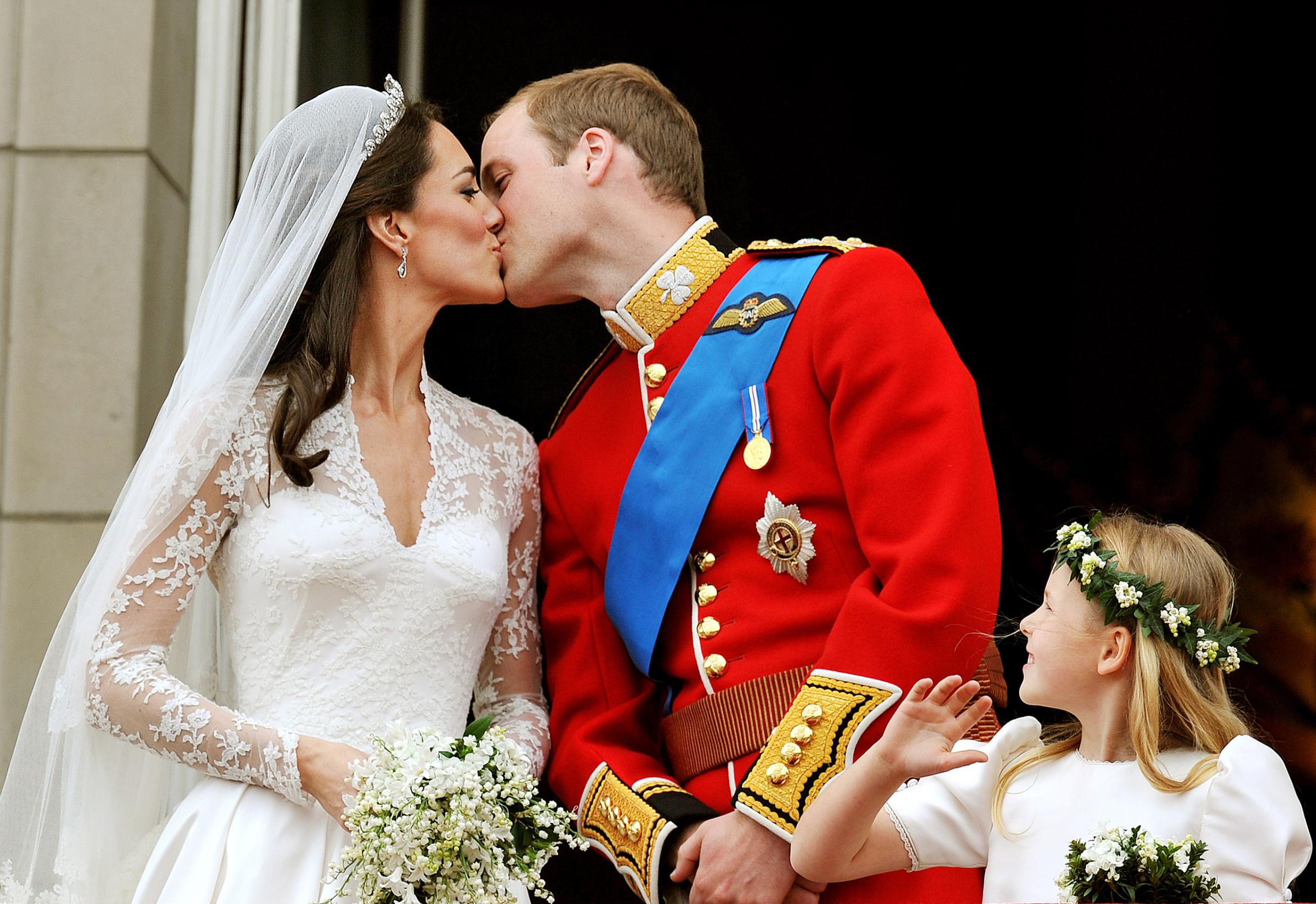 Prince William and Catherine kiss on the balcony of Buckingham Palace after getting married in London on April 29, 2011.
