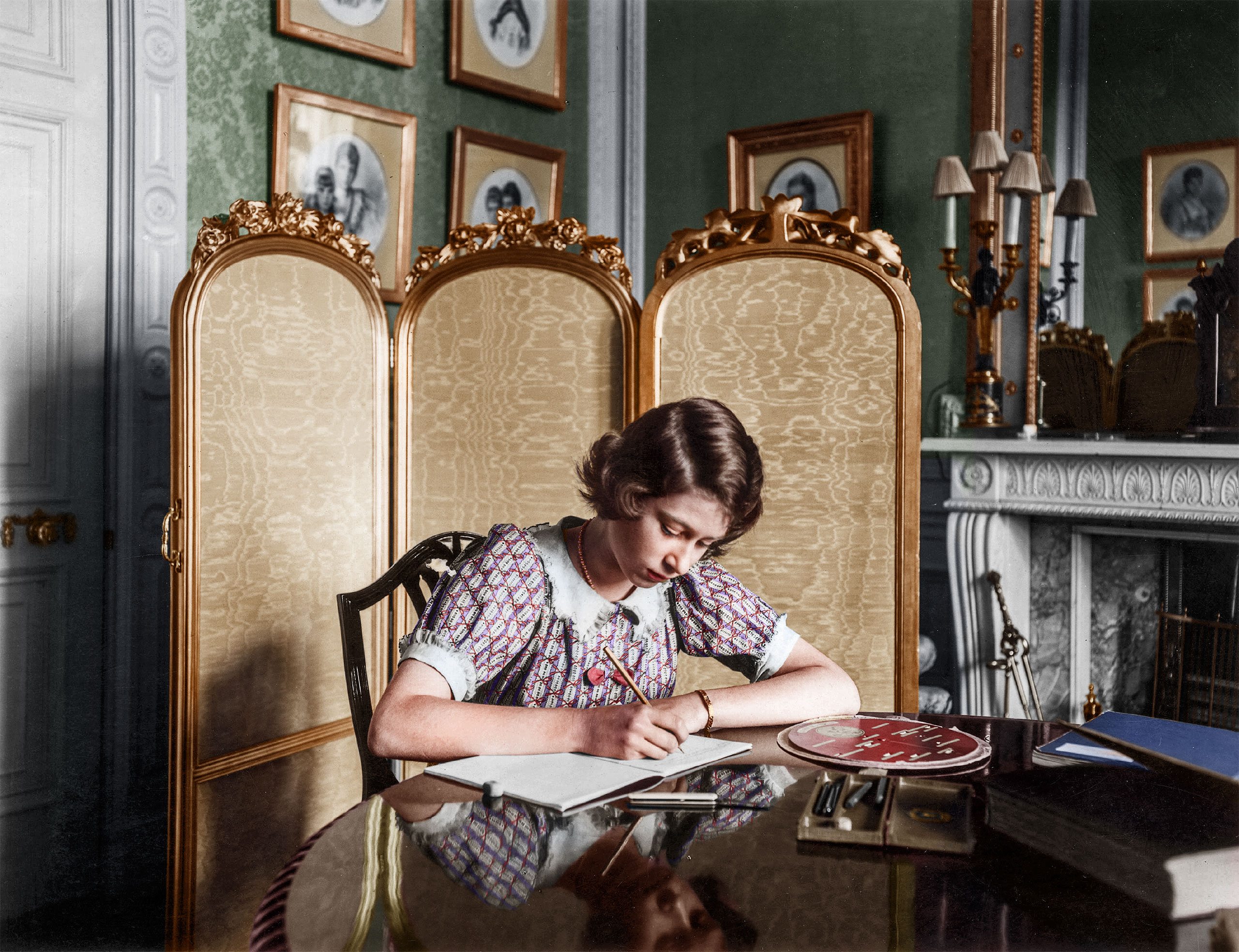 Princess Elizabeth working on her studies at a desk in Windsor Castle. June 1940.