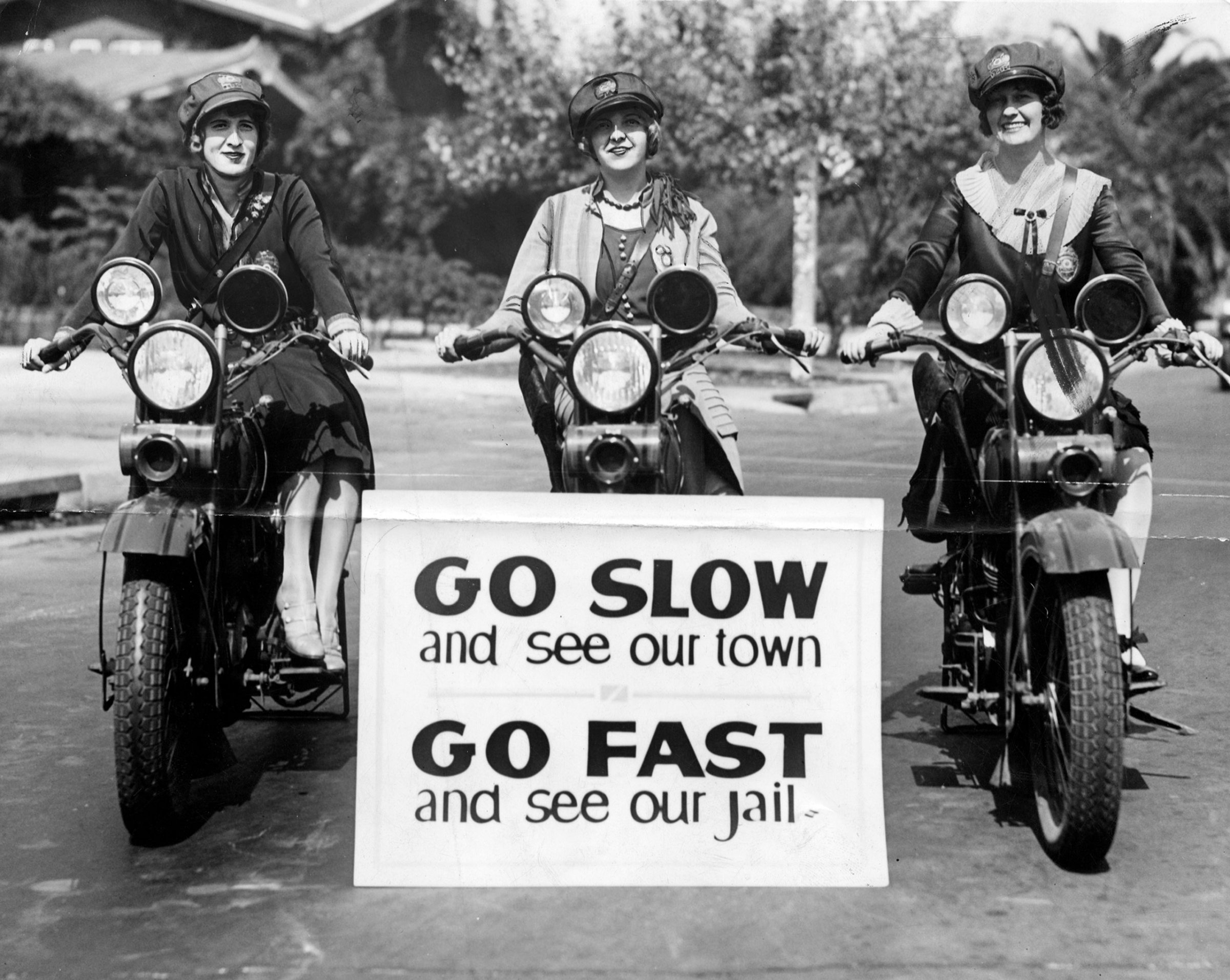Three motorcycle officers with the LAPD are on duty in 1927. From left to right: Miss Hildur Fleming; Miss Myra Richardson,; and Miss Beryl Wilson.